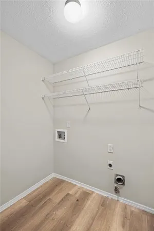 an aerial view of green landscape with trees houses and mountain view