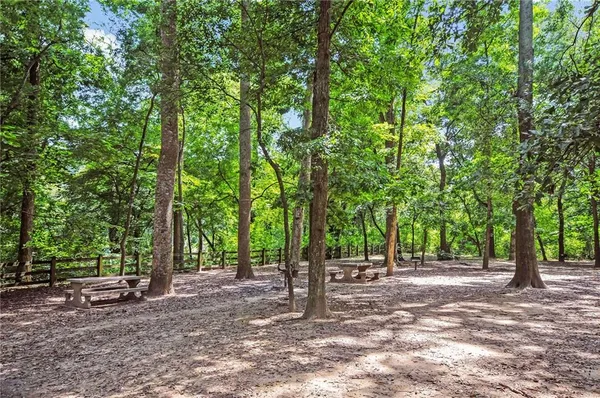 a view of a building with a large window and plants