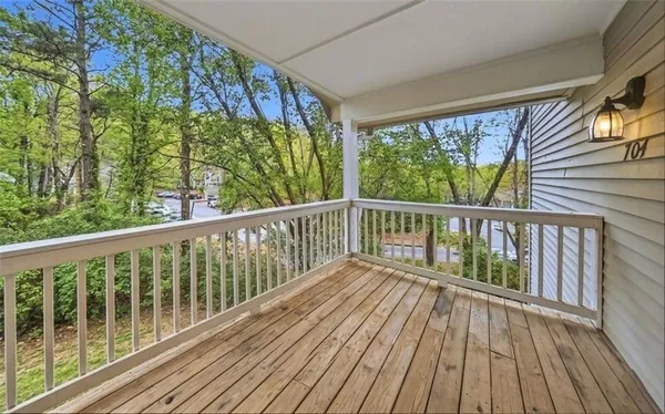 a view of balcony with wooden floor