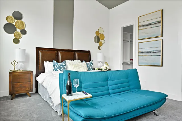 a living room with furniture and a lamp