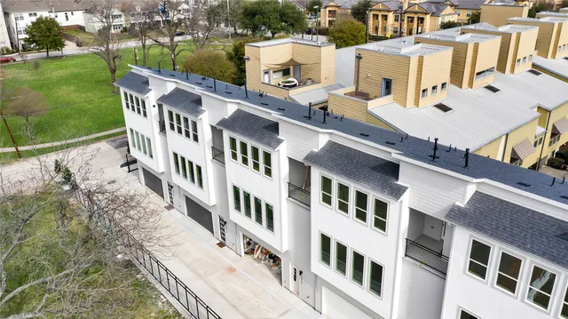 a view of a building with a yard