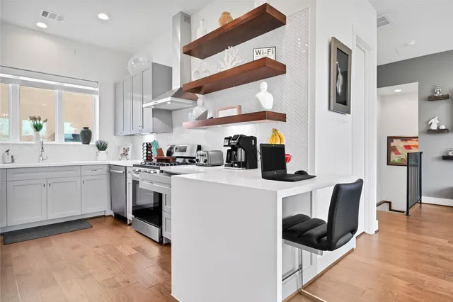a kitchen with a sink cabinets and window