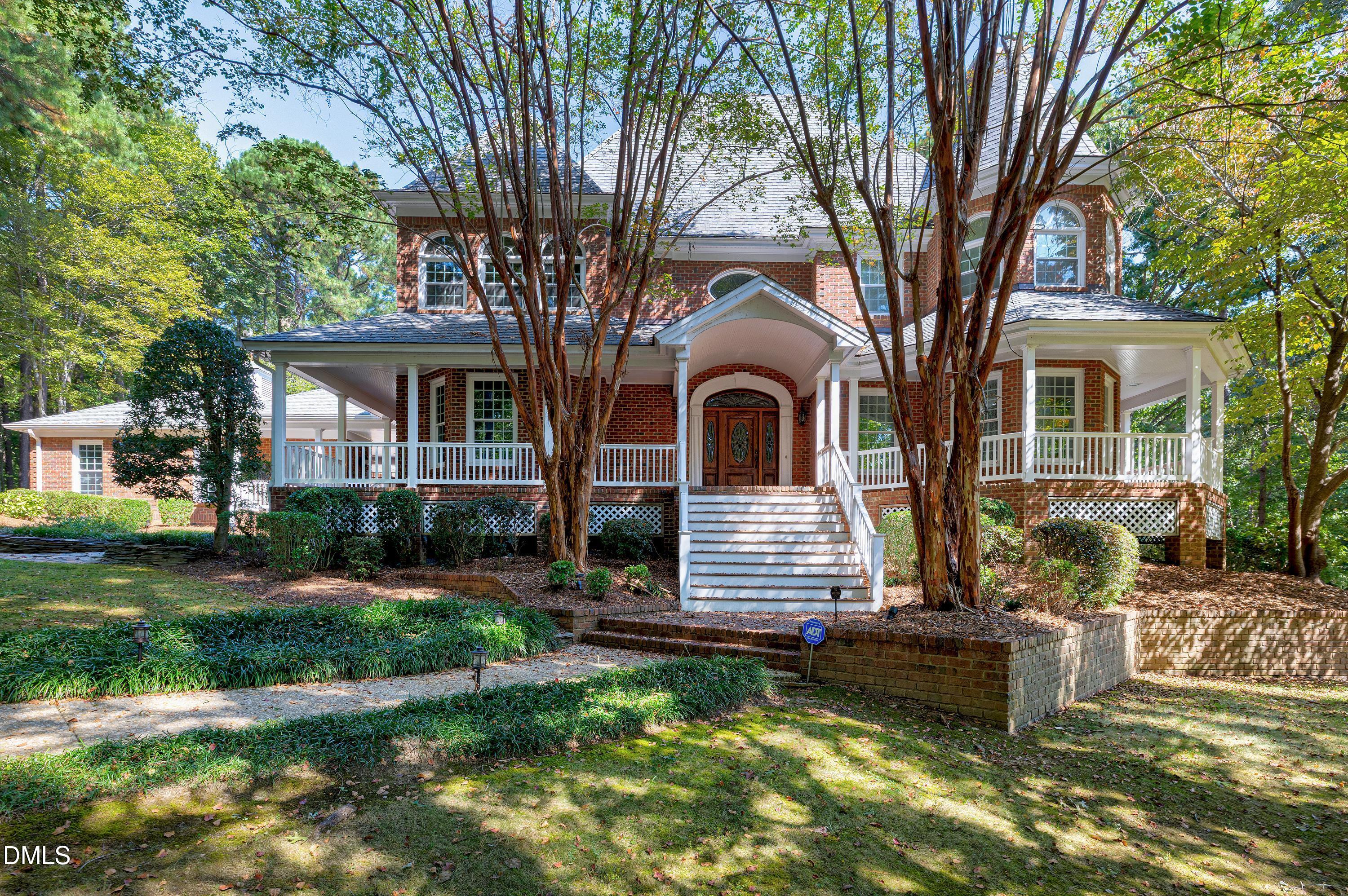 6825 Mactavish Way Raleigh, NC 27613 - Photo 3 of 100 a front view of a house with a yard
