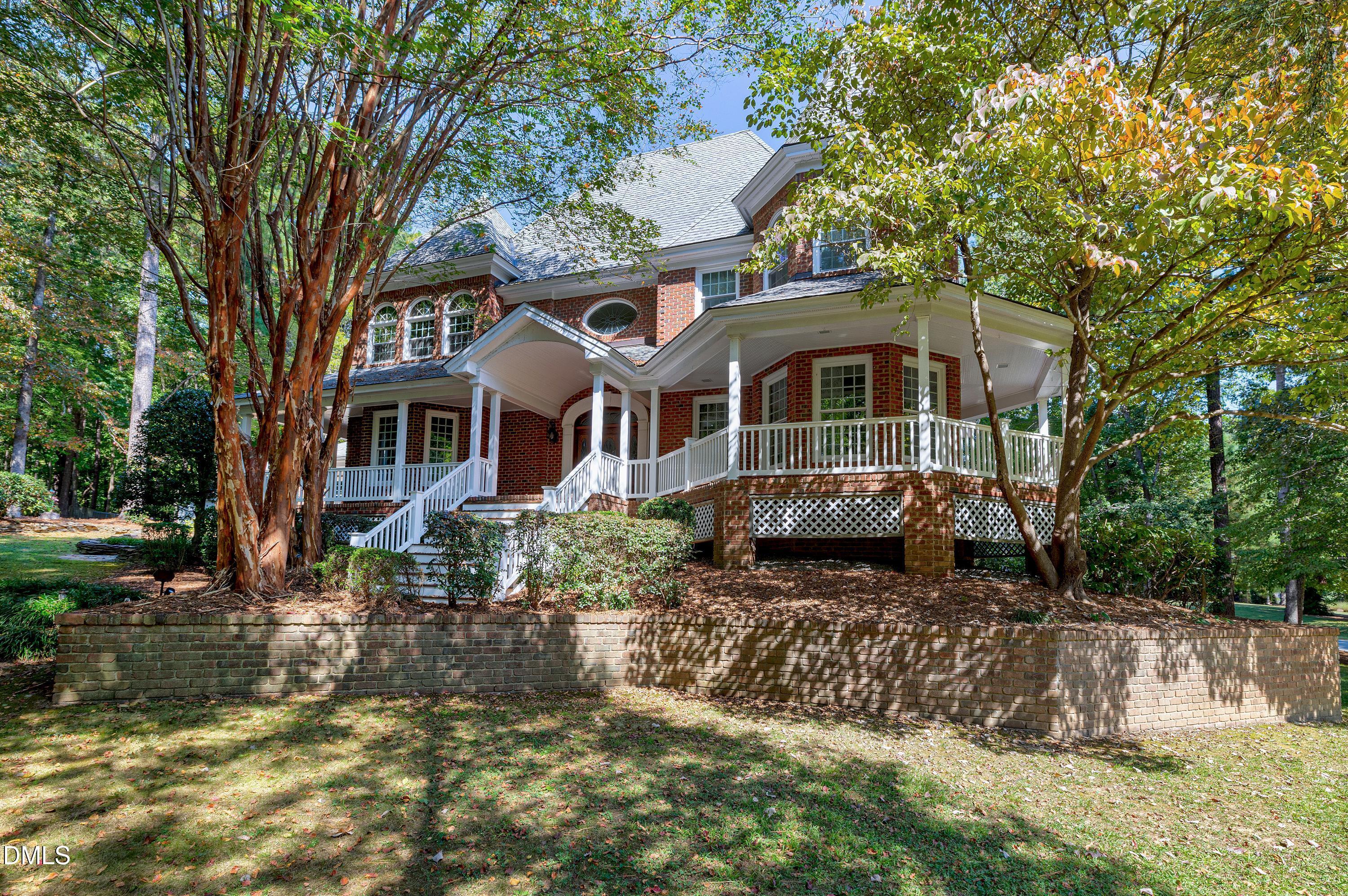 6825 Mactavish Way Raleigh, NC 27613 - Photo 4 of 100 a front view of a house with a yard