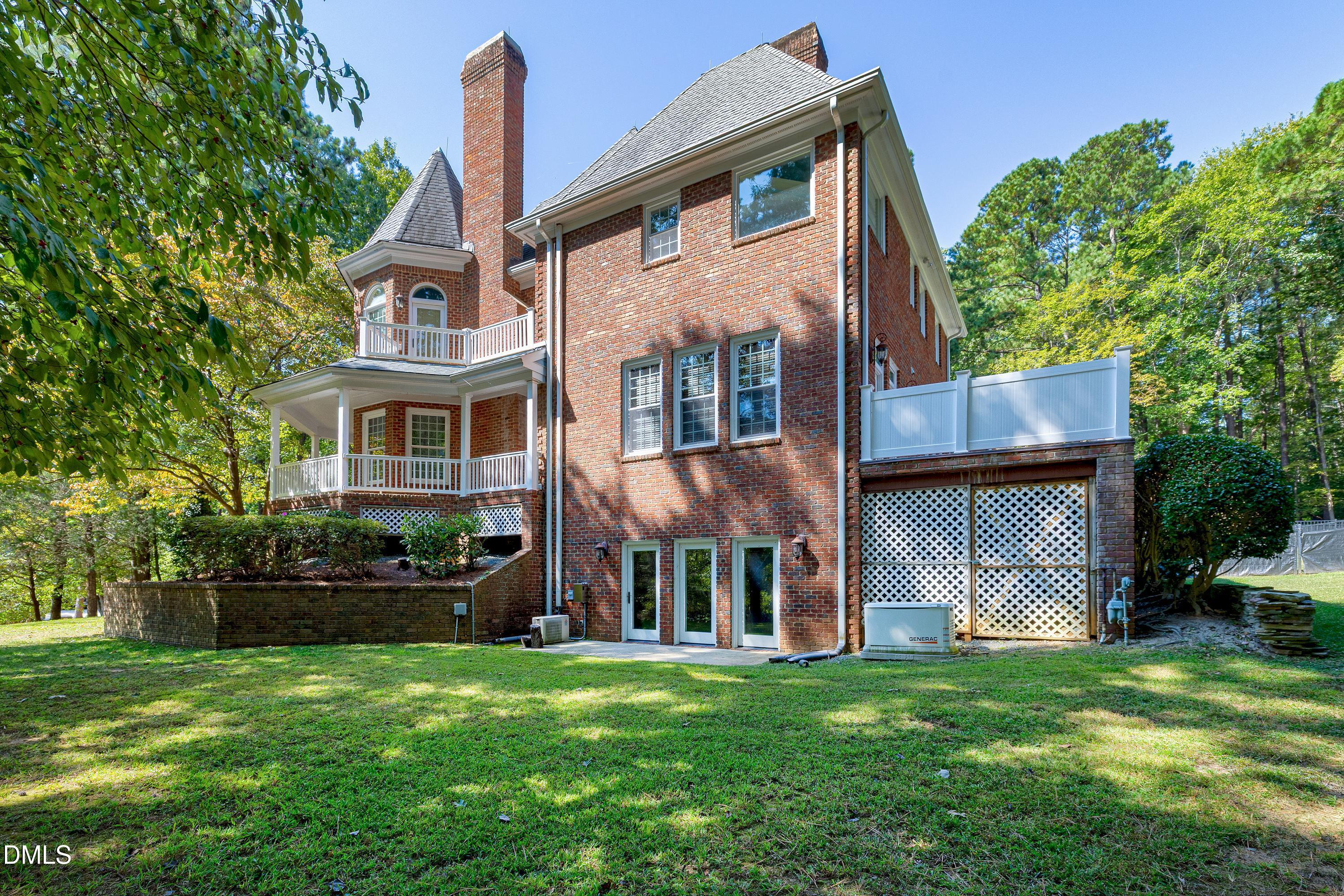 6825 Mactavish Way Raleigh, NC 27613 - Photo 57 of 100 front view of a house with a yard