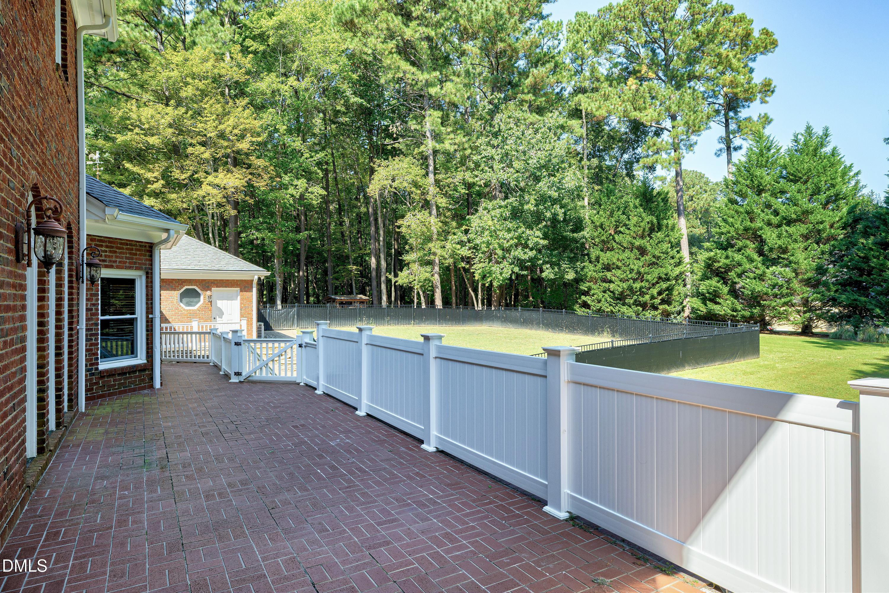 6825 Mactavish Way Raleigh, NC 27613 - Photo 65 of 100 a view of a house with a swimming pool and sitting area
