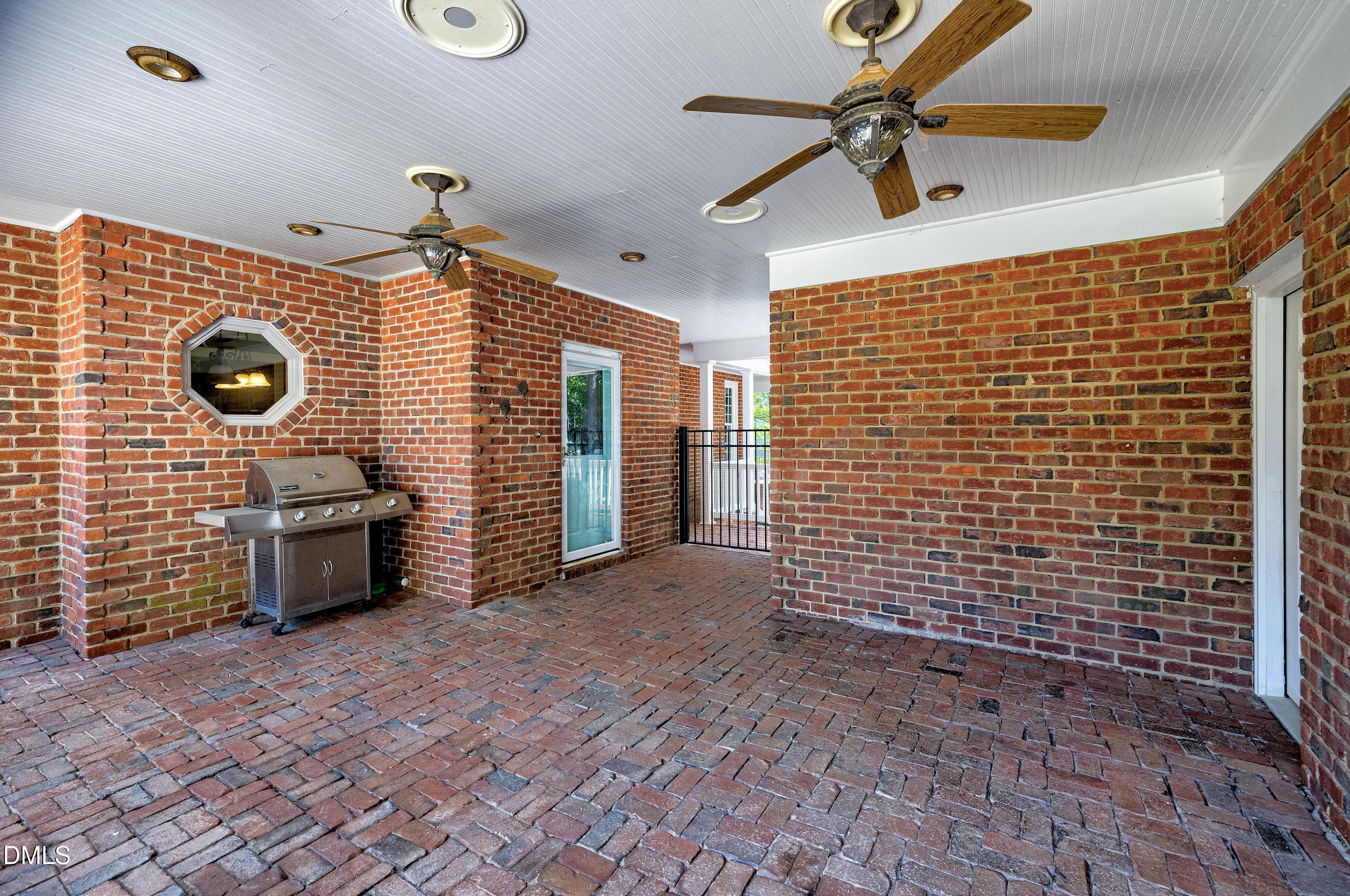 6825 Mactavish Way Raleigh, NC 27613 - Photo 68 of 100 a view of a livingroom with furniture and a ceiling fan
