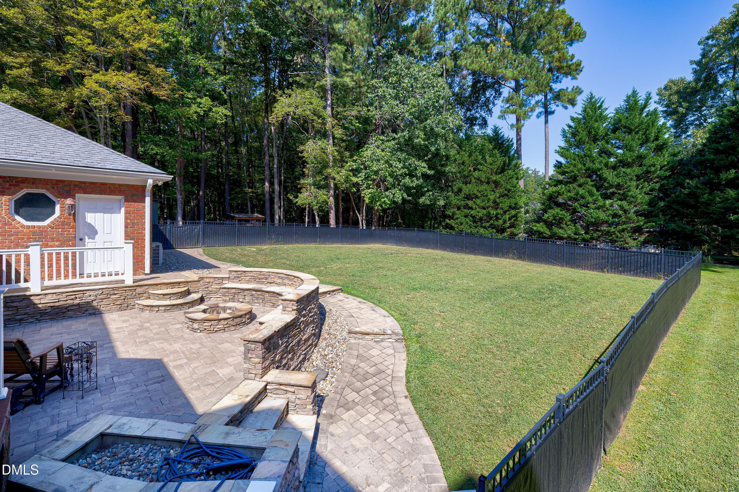 6825 Mactavish Way Raleigh, NC 27613 - Photo 69 of 100 a view of a backyard with sitting area