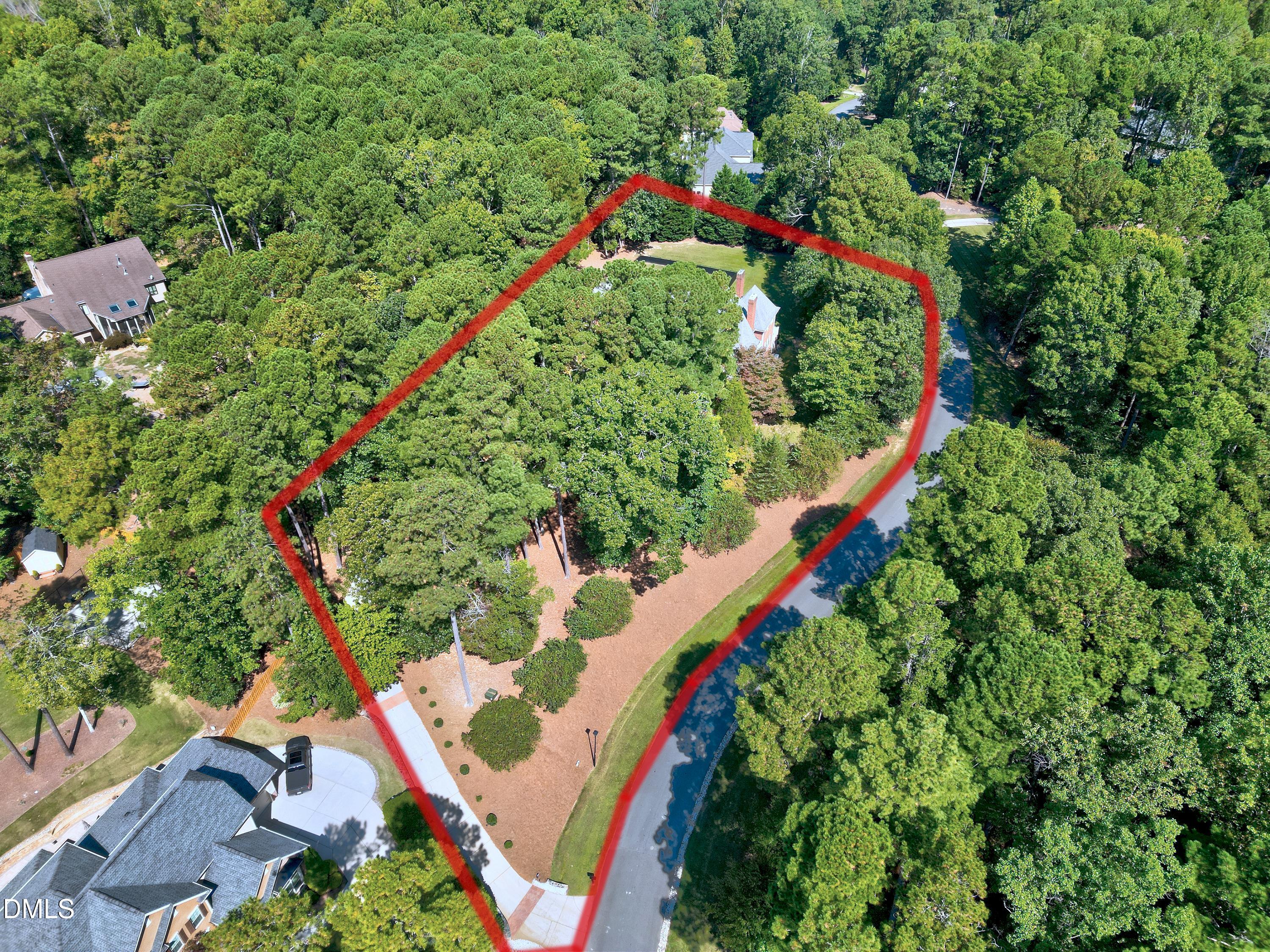 6825 Mactavish Way Raleigh, NC 27613 - Photo 77 of 100 an aerial view of a house with a yard and outdoor seating