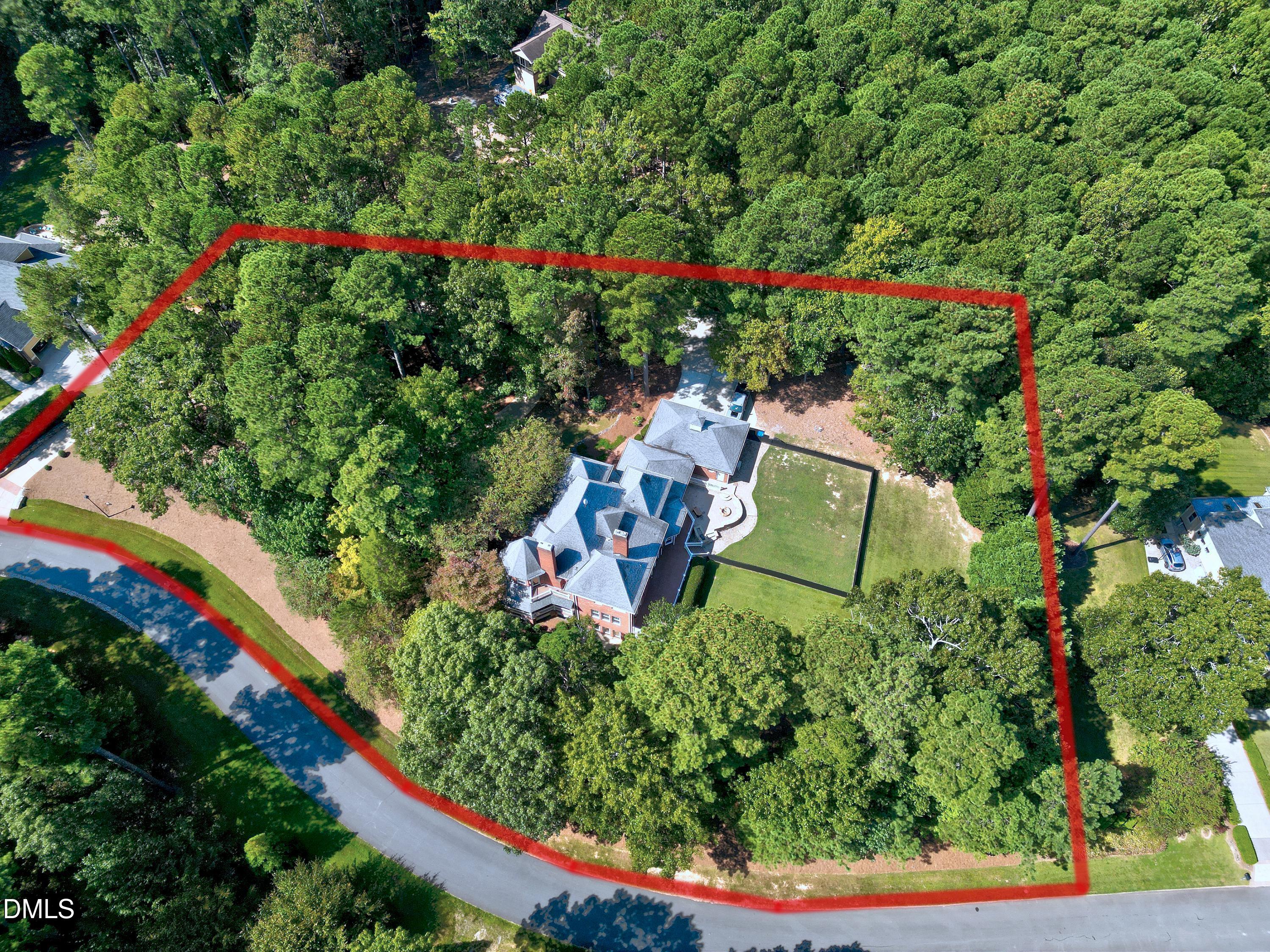6825 Mactavish Way Raleigh, NC 27613 - Photo 86 of 100 an aerial view of a house with a yard and fountain