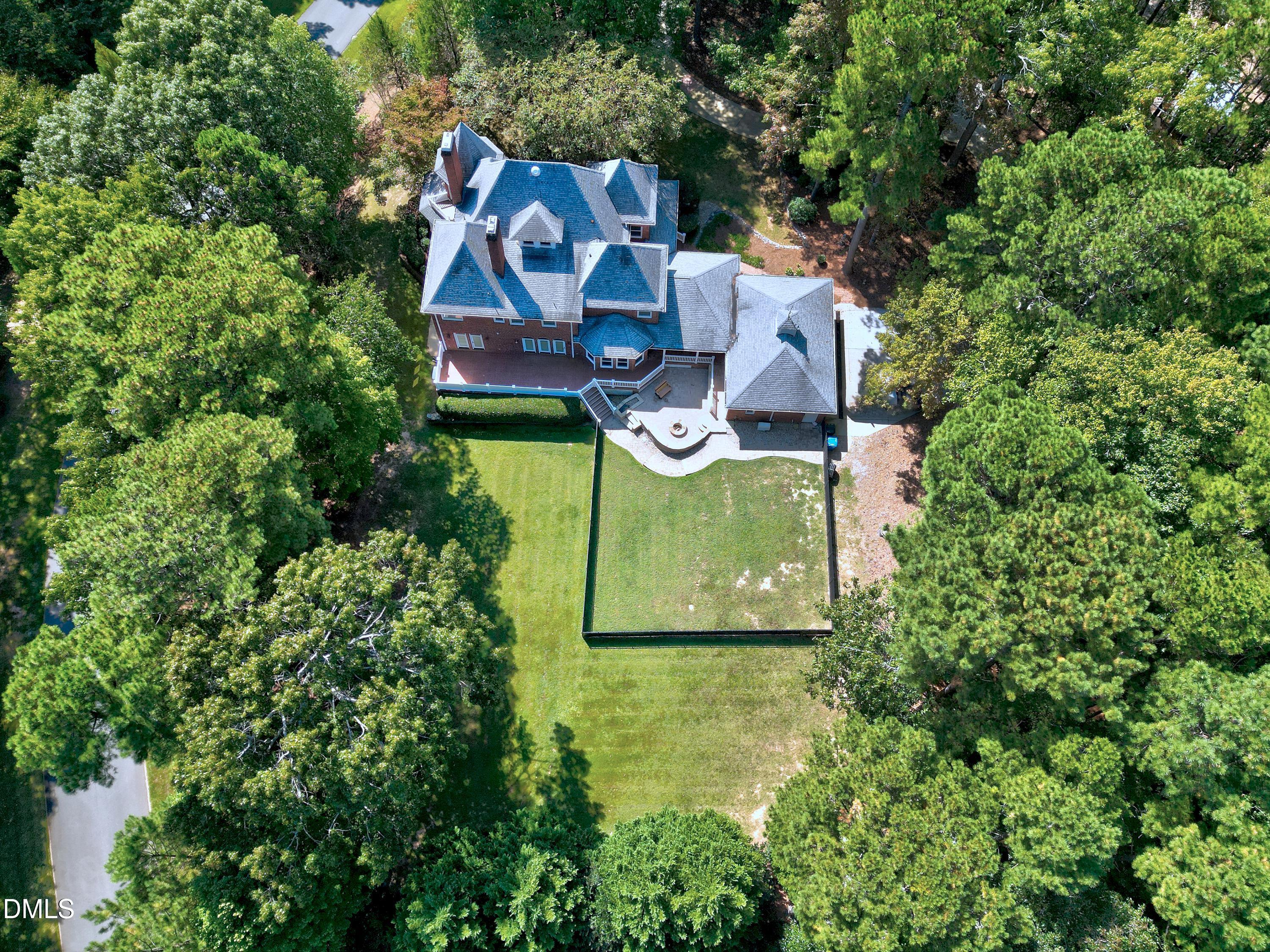 6825 Mactavish Way Raleigh, NC 27613 - Photo 89 of 100 an aerial view of a house with outdoor space pool seating area and yard