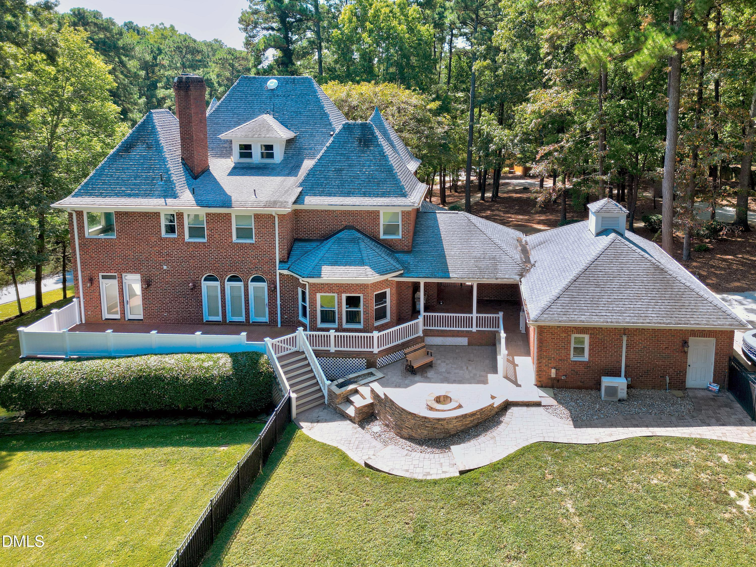 6825 Mactavish Way Raleigh, NC 27613 - Photo 92 of 100 a aerial view of a house with swimming pool and patio