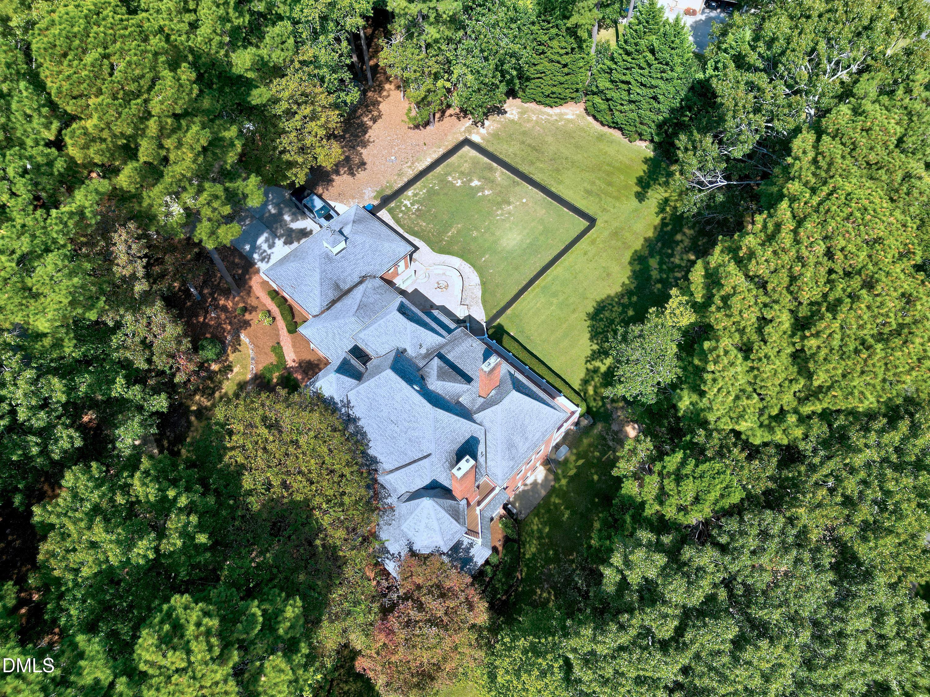 6825 Mactavish Way Raleigh, NC 27613 - Photo 93 of 100 an aerial view of a house with a yard and trees