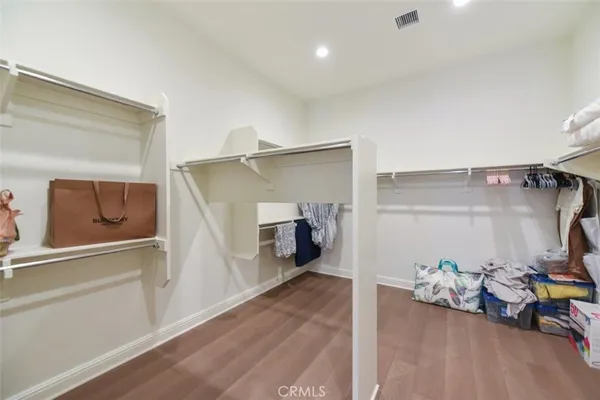 a view of a livingroom with furniture and a hallway