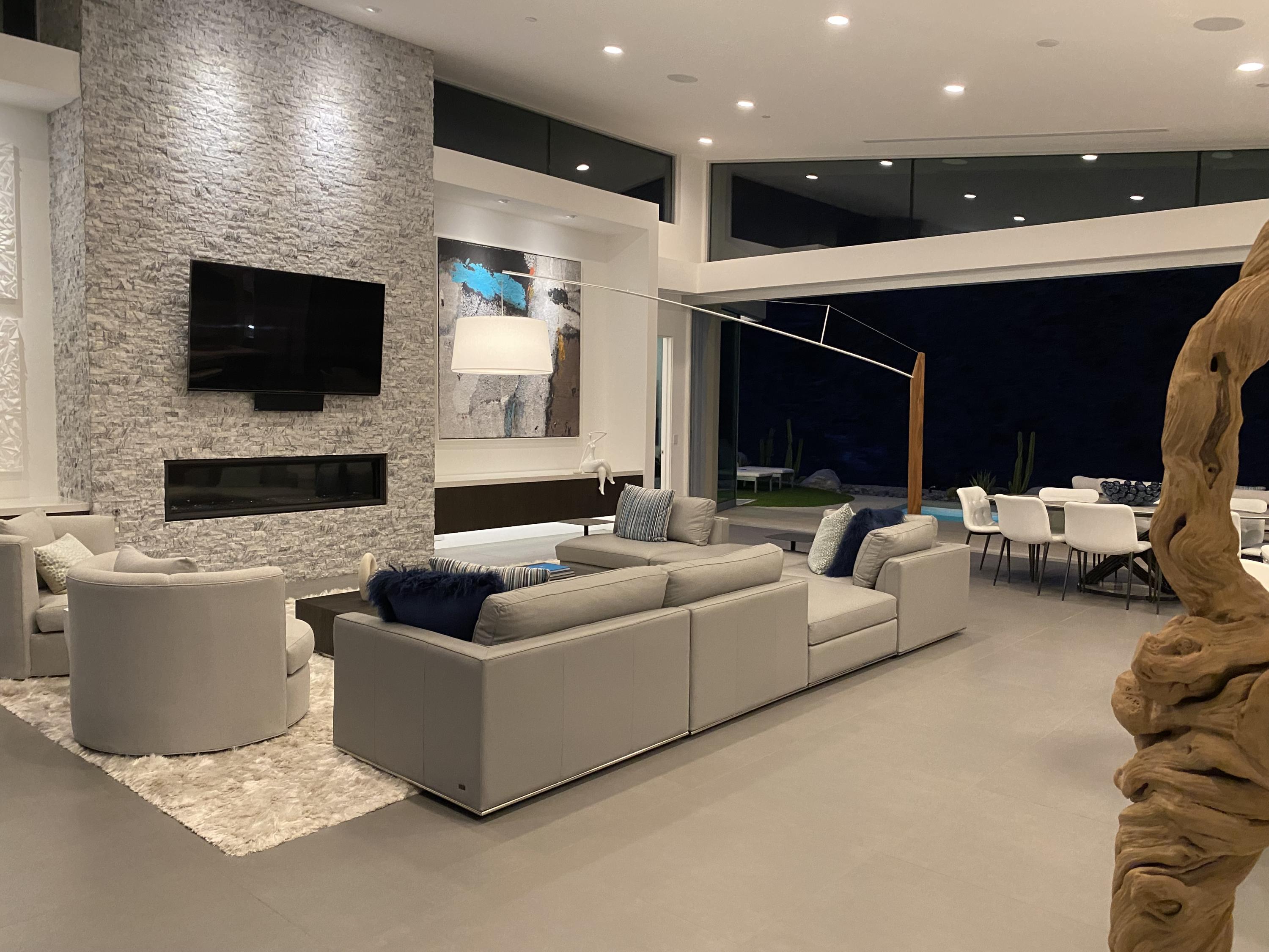 1747 Pinnacle Point Palm Springs, CA 92264 - Photo 18 of 76 a living room with furniture and a fireplace