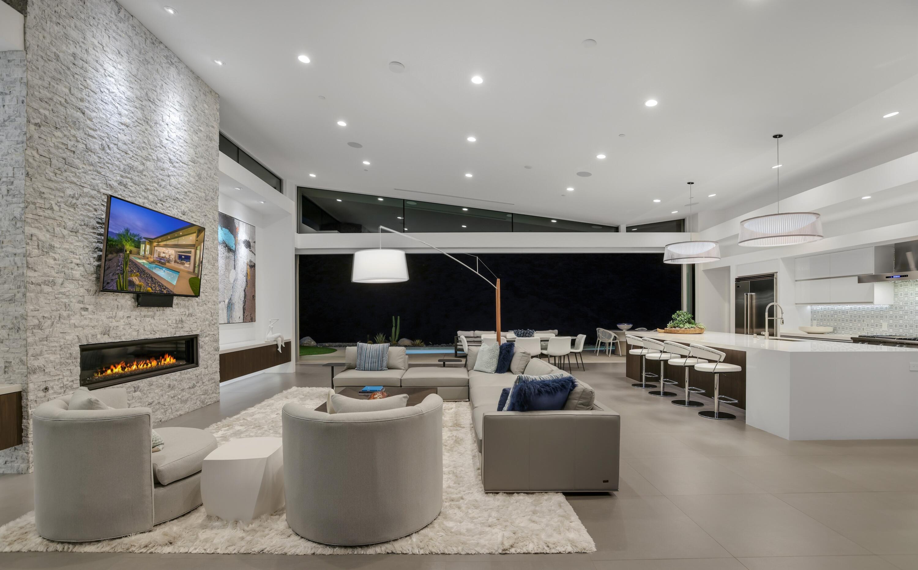 1747 Pinnacle Point Palm Springs, CA 92264 - Photo 21 of 76 a living room with furniture and a flat screen tv