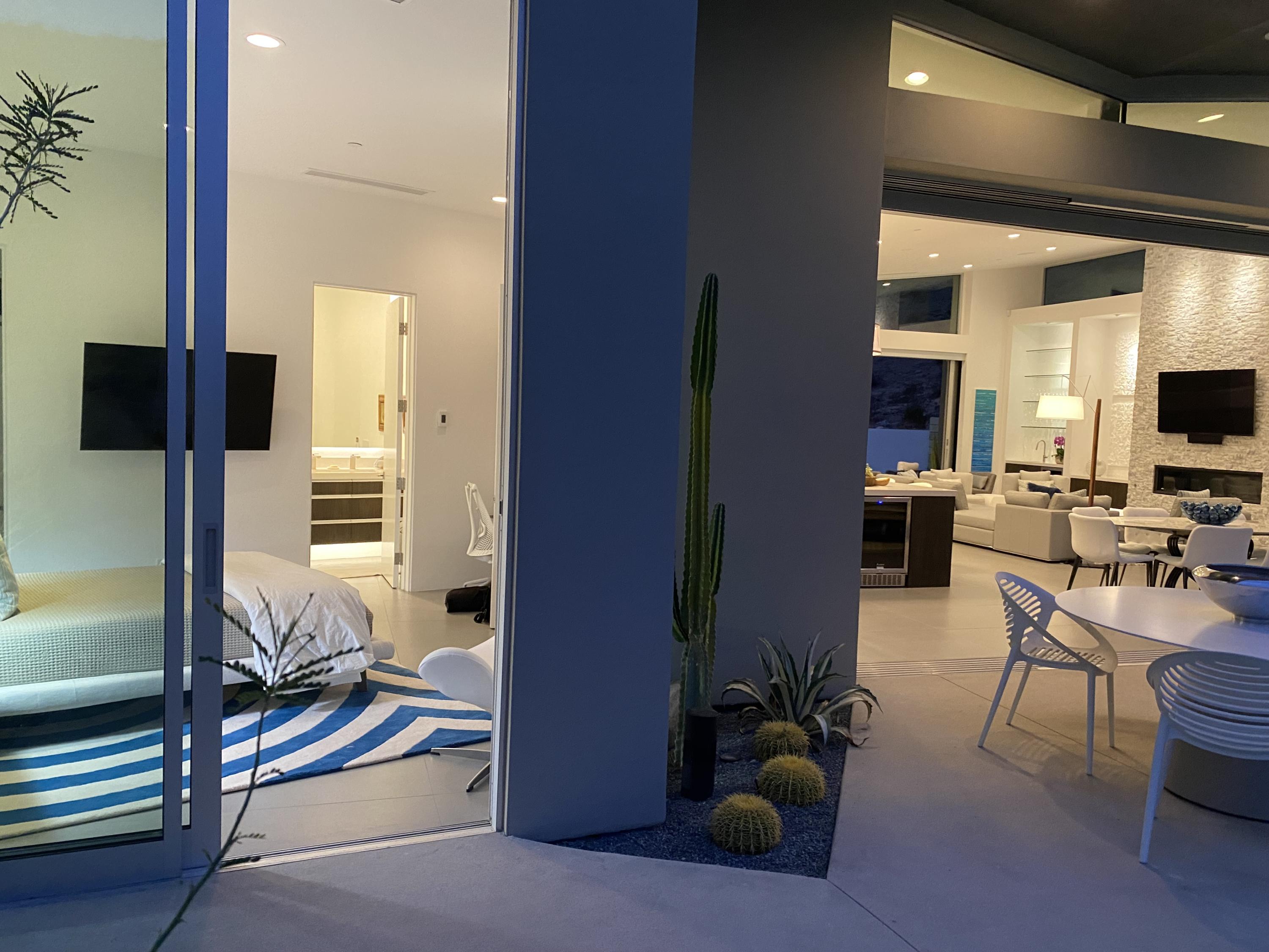 1747 Pinnacle Point Palm Springs, CA 92264 - Photo 27 of 76 a living room with furniture a flat screen tv and a view of living room