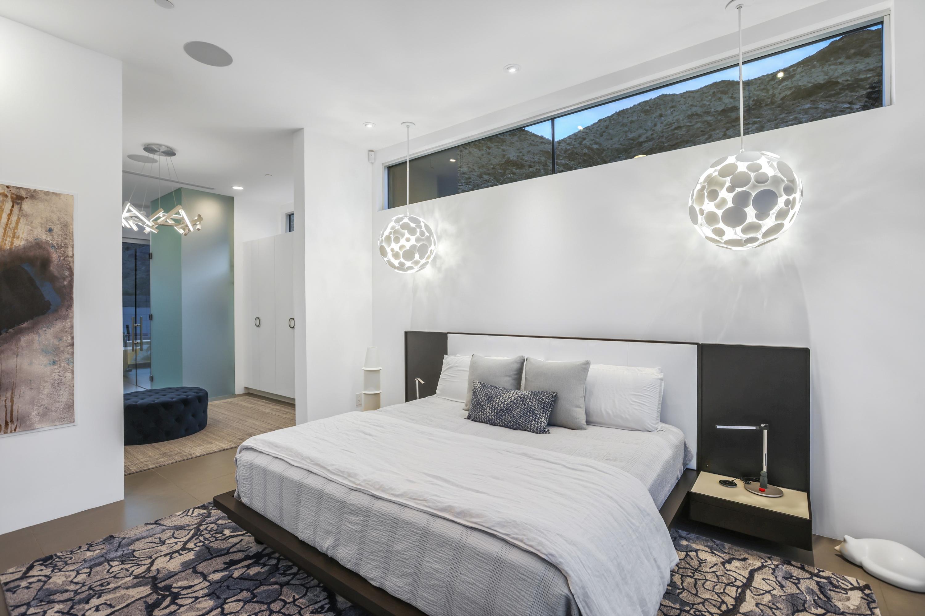 1747 Pinnacle Point Palm Springs, CA 92264 - Photo 32 of 76 a bedroom with a bed and a view of bathroom