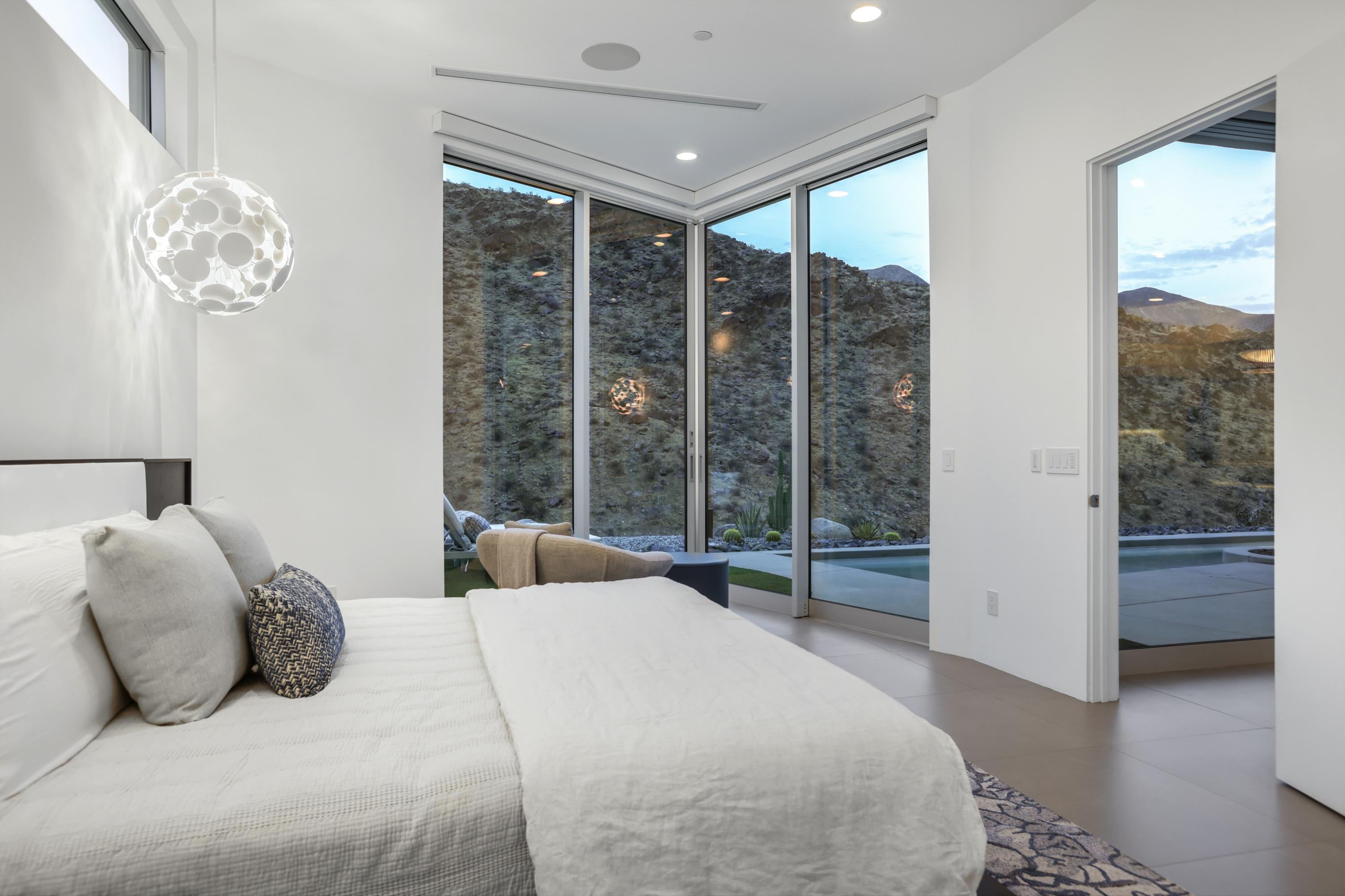 1747 Pinnacle Point Palm Springs, CA 92264 - Photo 33 of 76 a bedroom with a large bed and a large window