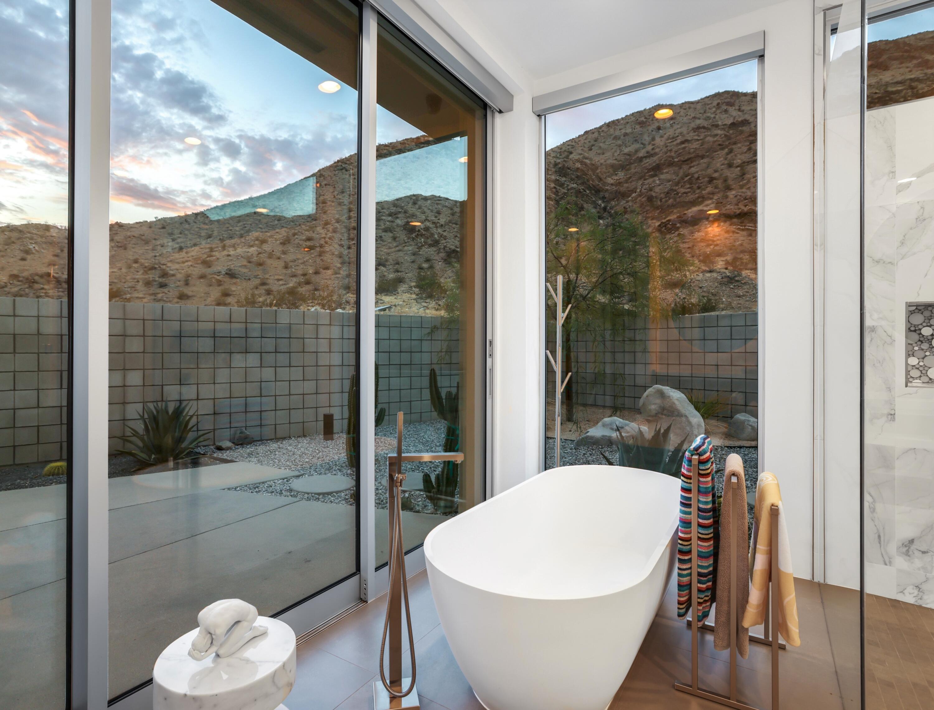 1747 Pinnacle Point Palm Springs, CA 92264 - Photo 36 of 76 a white bath tub sitting next to a bathroom
