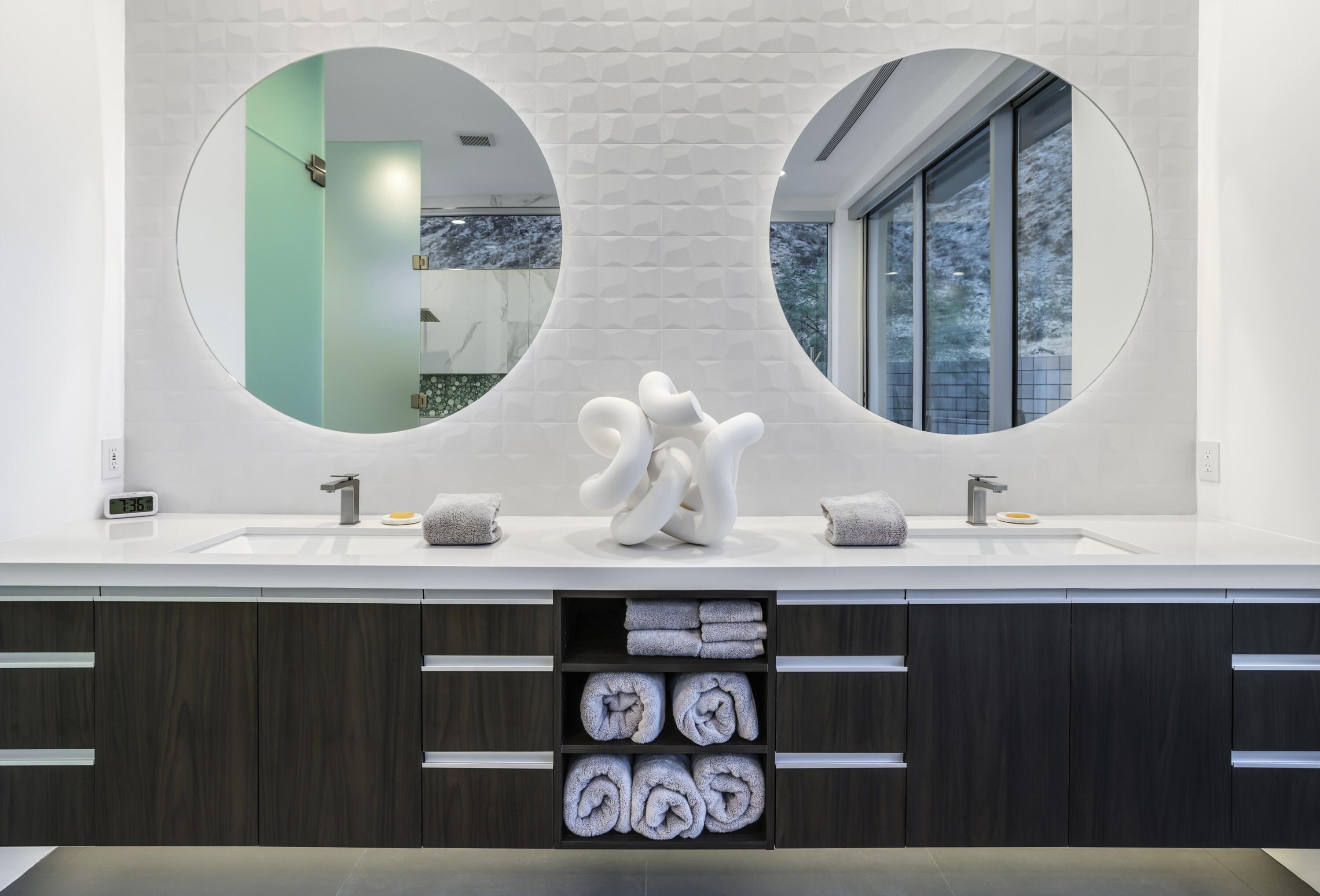 1747 Pinnacle Point Palm Springs, CA 92264 - Photo 37 of 76 a bathroom with a double vanity sink and a mirror