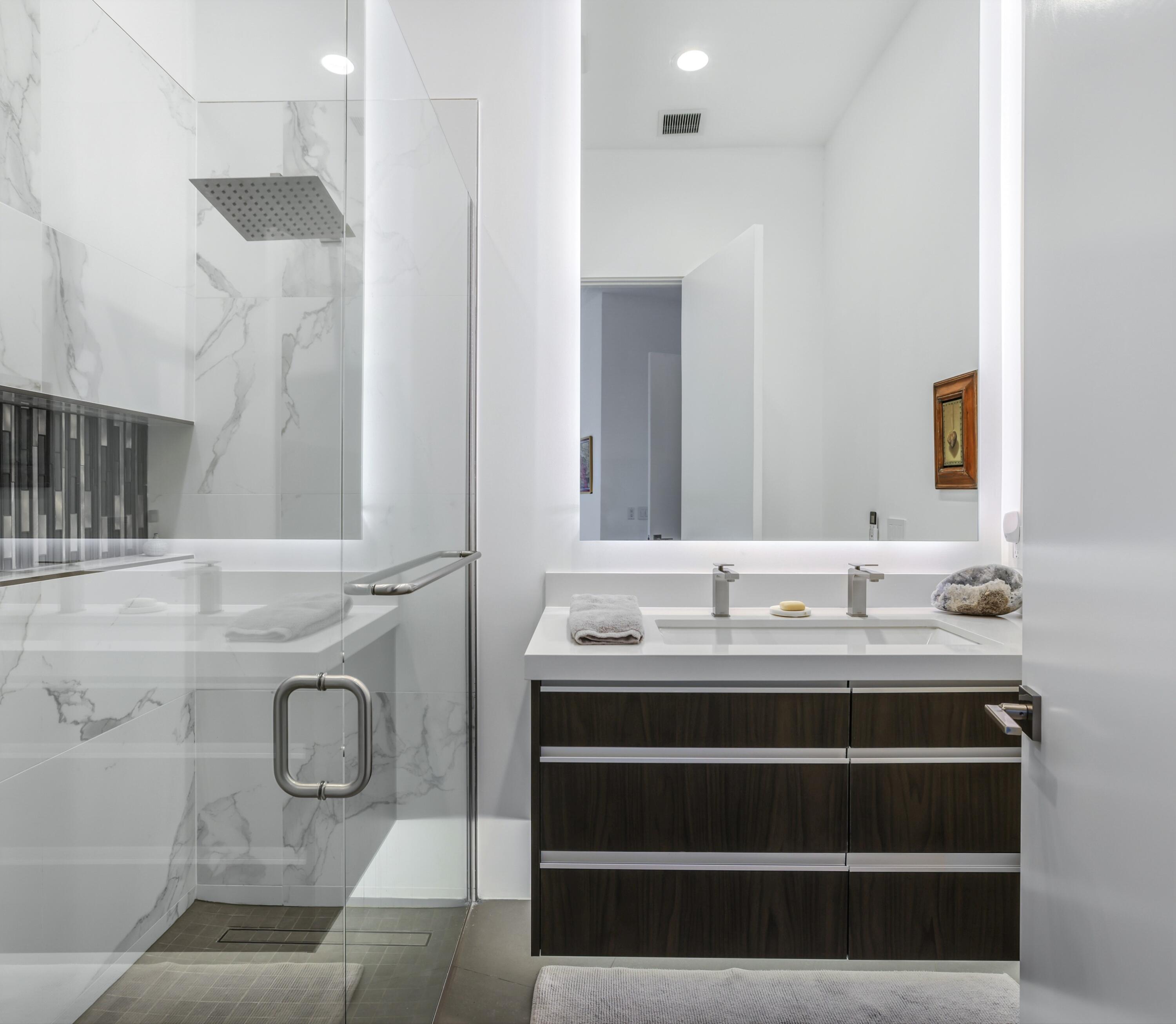 1747 Pinnacle Point Palm Springs, CA 92264 - Photo 40 of 76 a bathroom with a granite countertop sink and a mirror