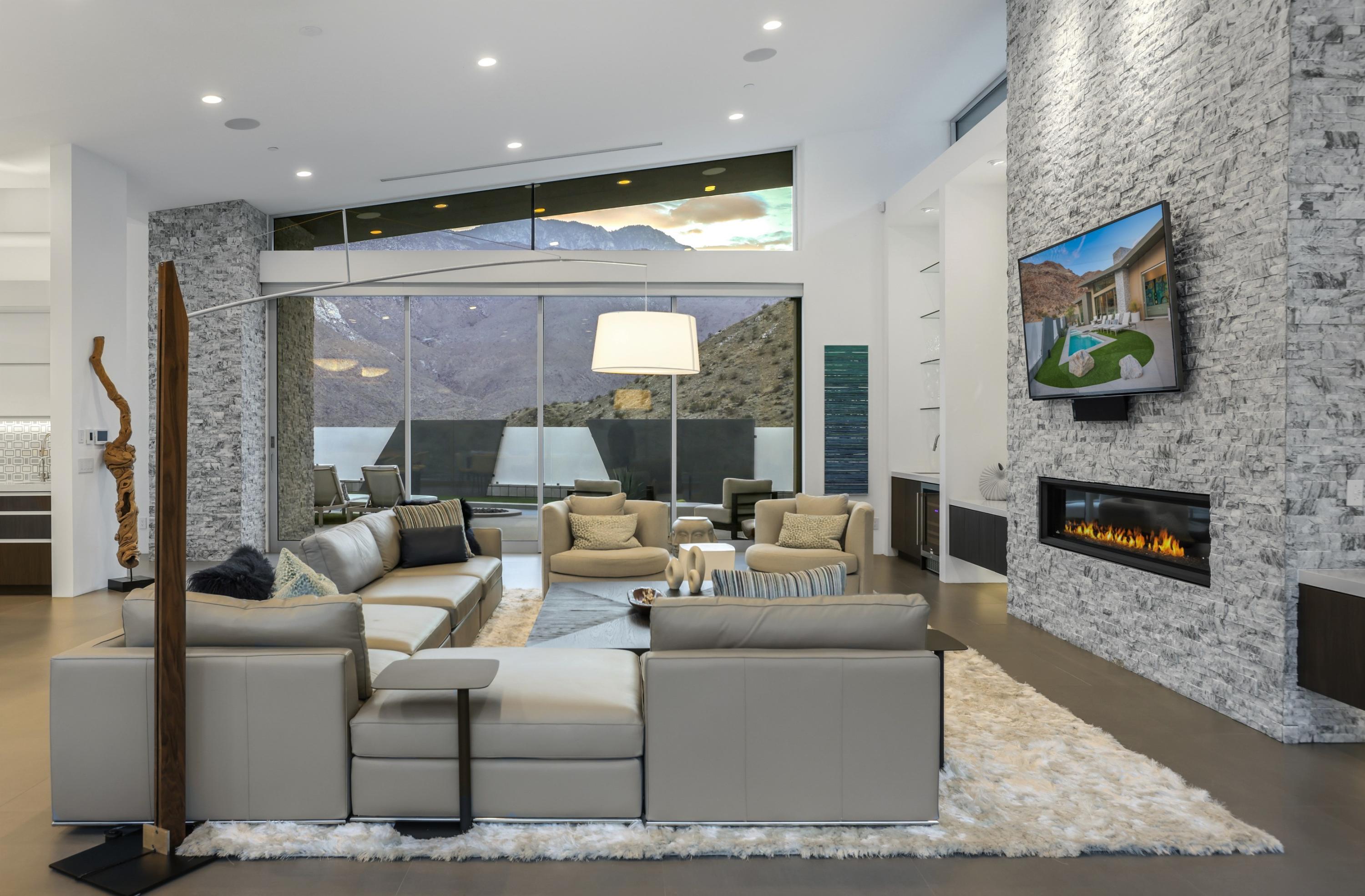 1747 Pinnacle Point Palm Springs, CA 92264 - Photo 49 of 76 a living room with fireplace furniture and a flat screen tv