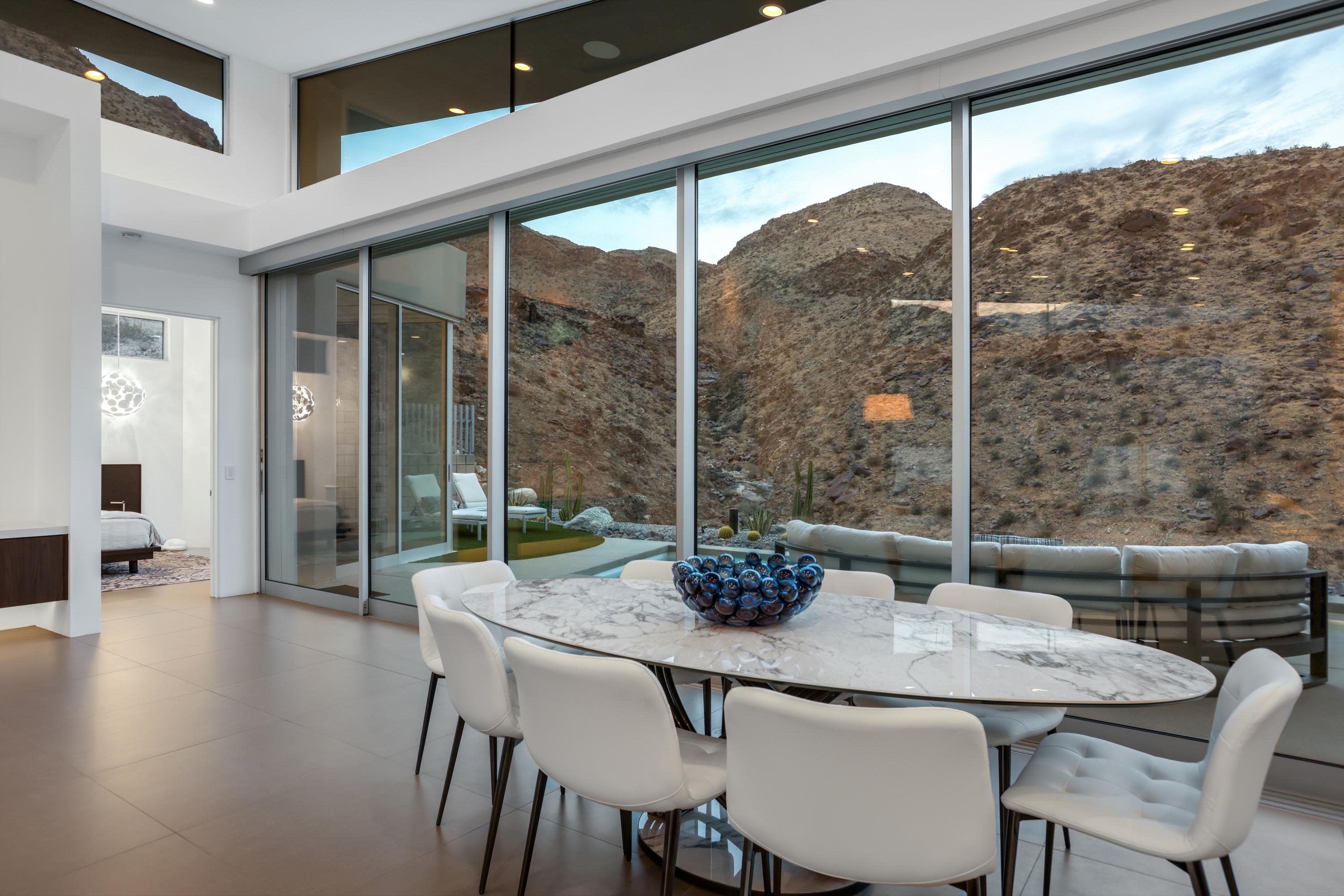 1747 Pinnacle Point Palm Springs, CA 92264 - Photo 50 of 76 a dining room with furniture and wooden floor
