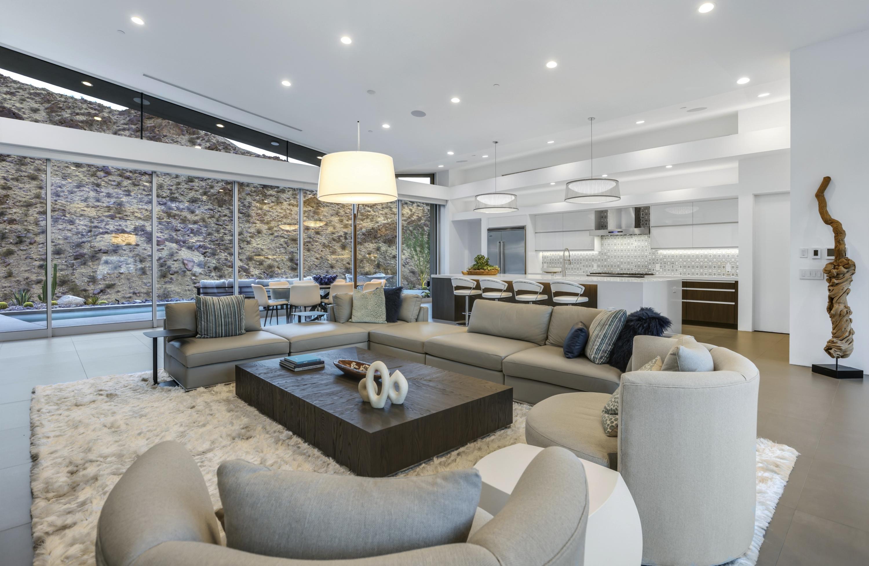 1747 Pinnacle Point Palm Springs, CA 92264 - Photo 57 of 76 a living room with fireplace furniture and a view of kitchen