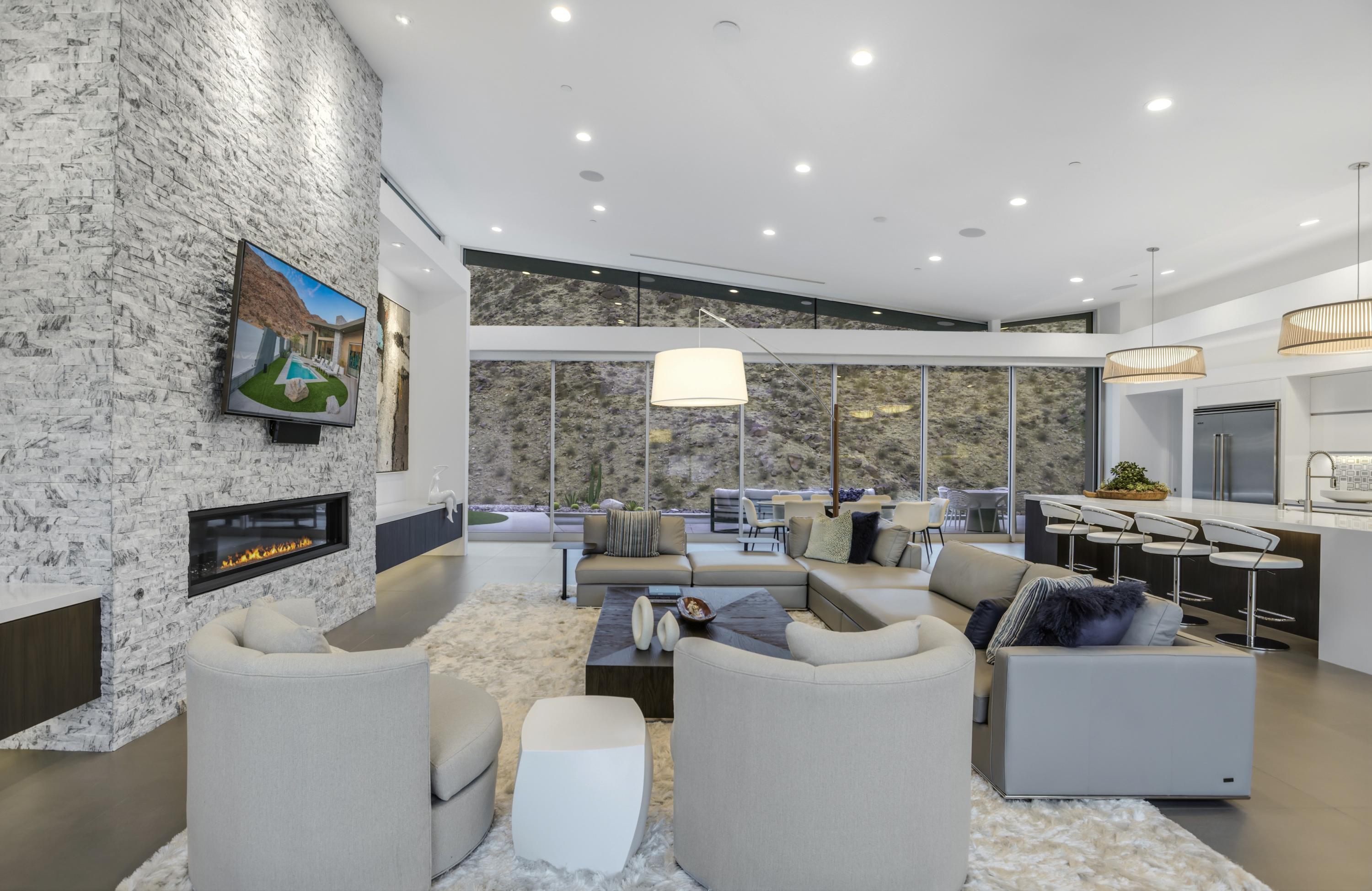 1747 Pinnacle Point Palm Springs, CA 92264 - Photo 58 of 76 a living room with fireplace furniture and a flat screen tv