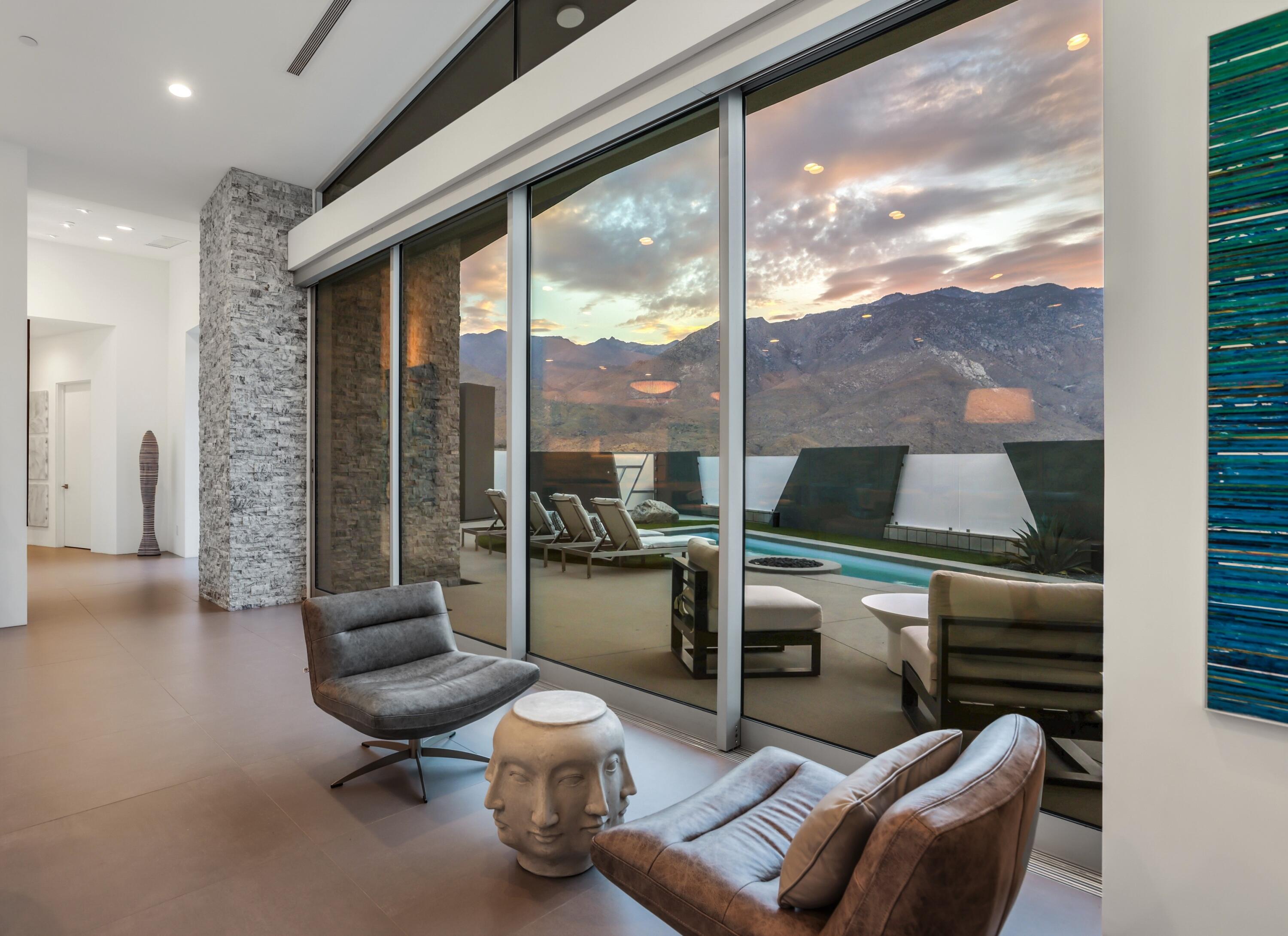 1747 Pinnacle Point Palm Springs, CA 92264 - Photo 59 of 76 a room with furniture and a floor to ceiling window