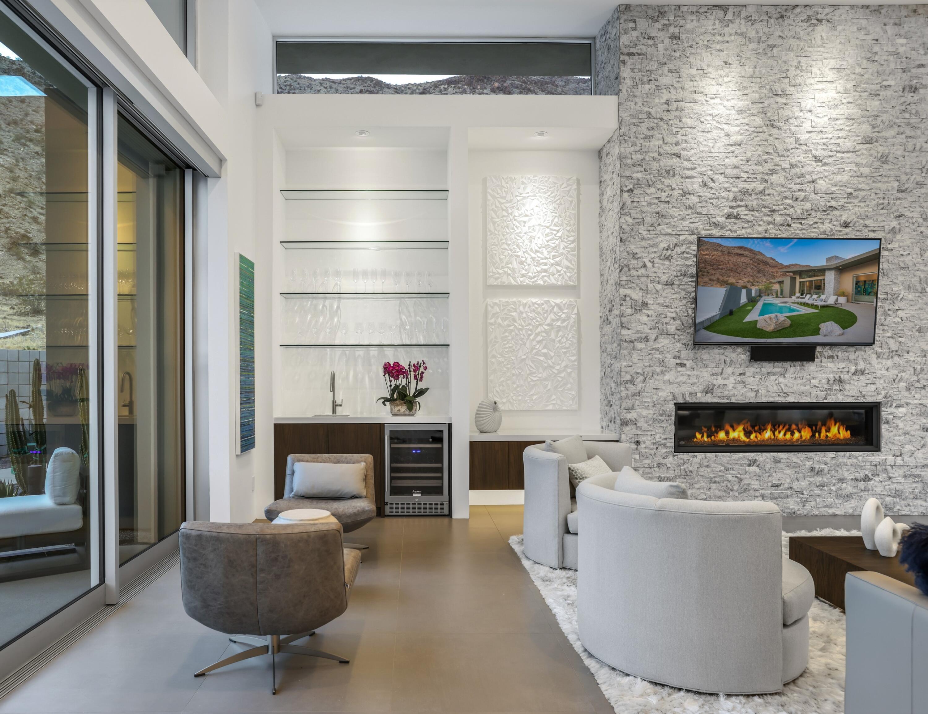 1747 Pinnacle Point Palm Springs, CA 92264 - Photo 60 of 76 a living room with furniture and a fireplace