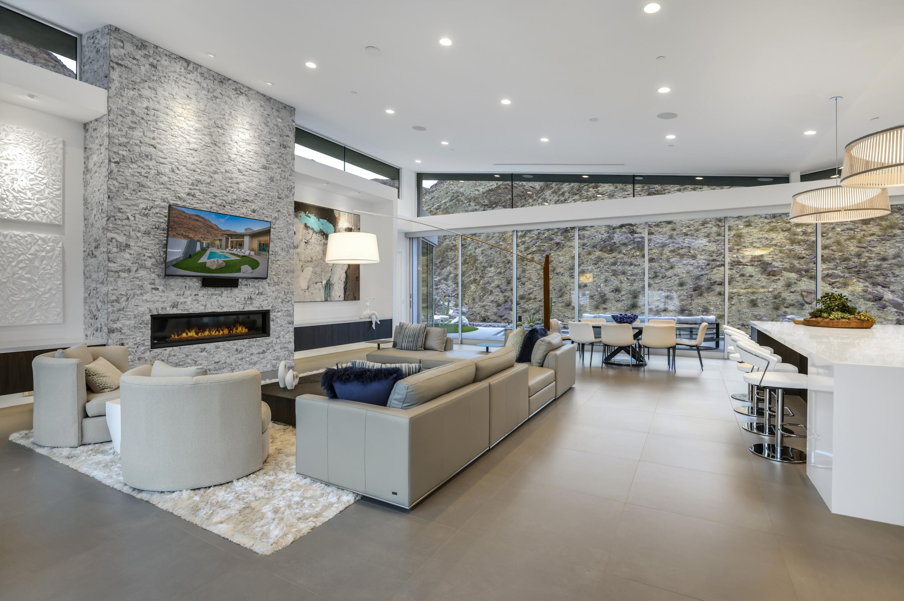 1747 Pinnacle Point Palm Springs, CA 92264 - Photo 61 of 76 a living room with fireplace furniture and a large window