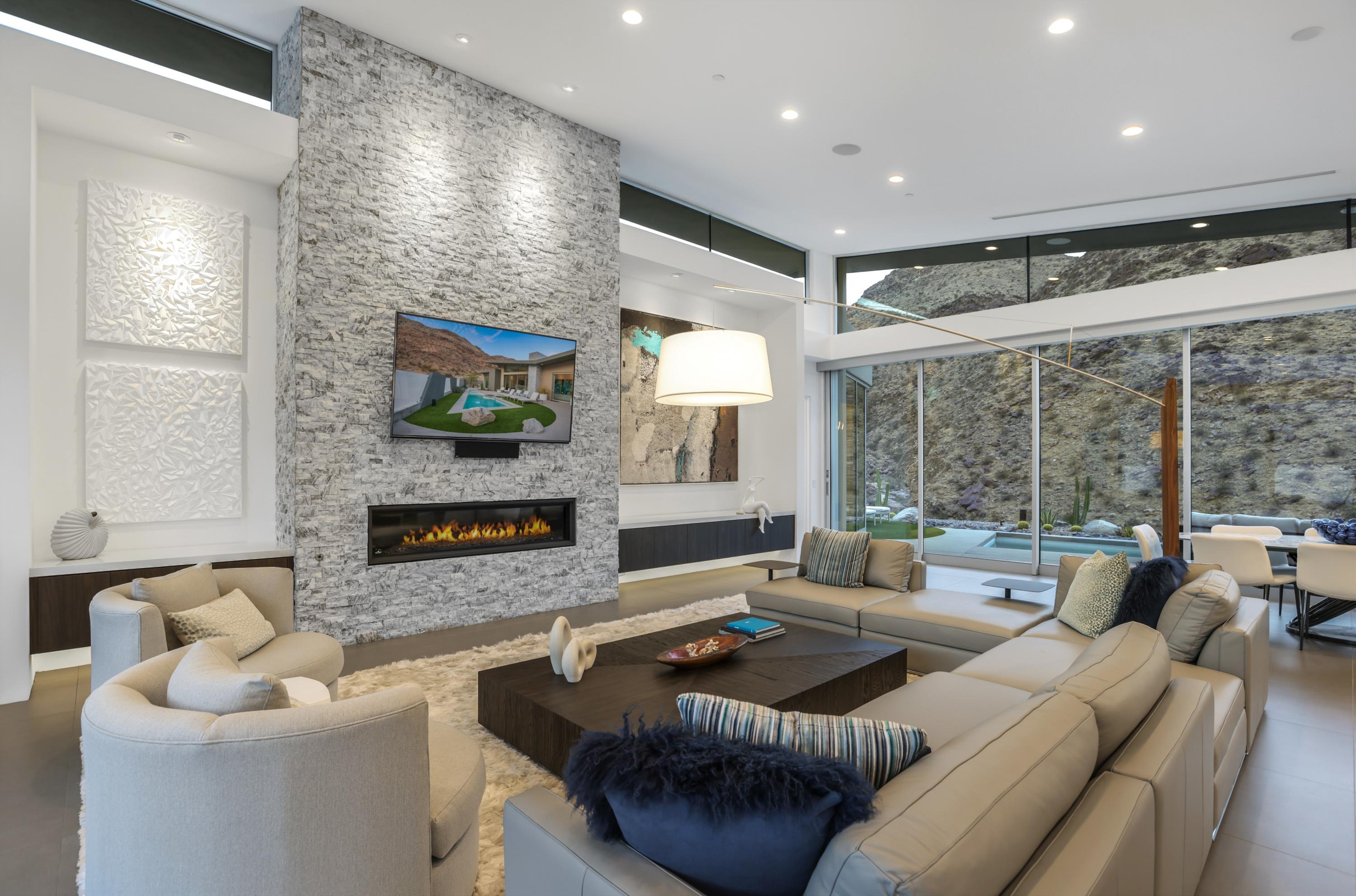 1747 Pinnacle Point Palm Springs, CA 92264 - Photo 64 of 76 a living room with fireplace furniture and a large window