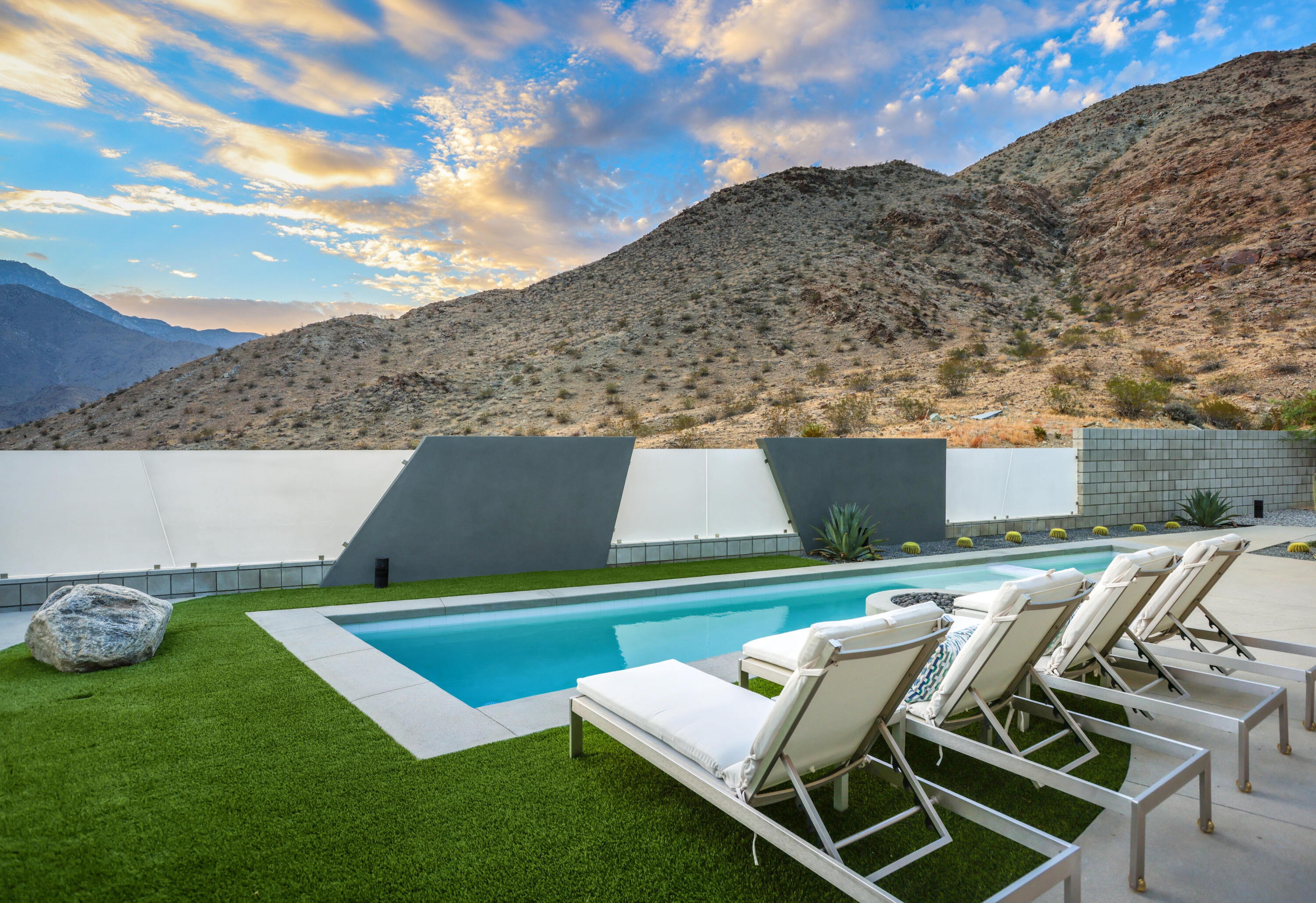 1747 Pinnacle Point Palm Springs, CA 92264 - Photo 69 of 76 a view of a backyard with furniture