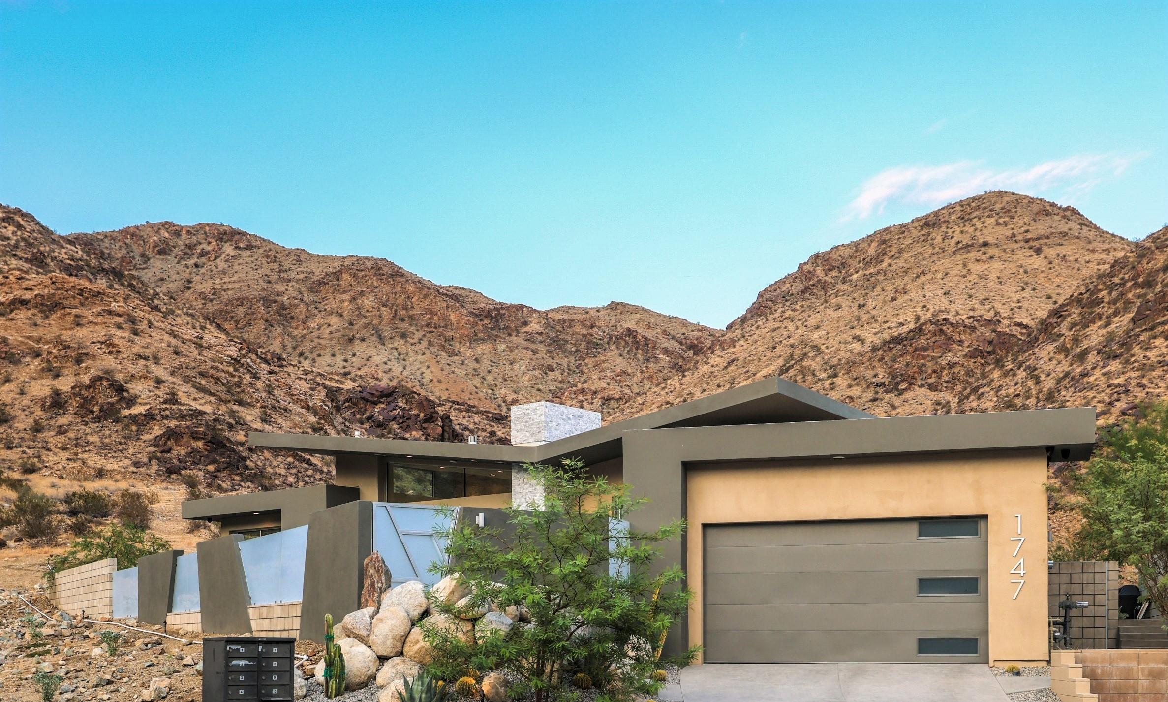 1747 Pinnacle Point Palm Springs, CA 92264 - Photo 73 of 76 a front view of a house with a yard and mountain view in back