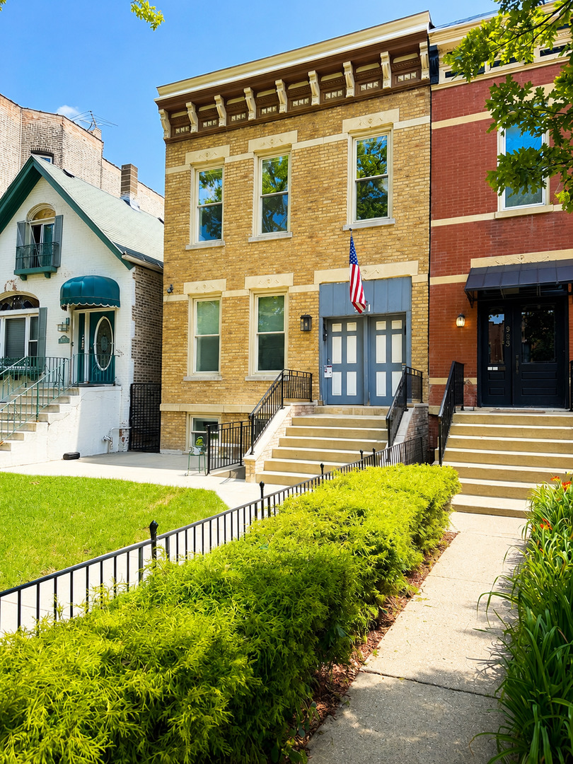 921 South Bishop Street, Unit 2 Chicago, IL 60607 - Photo 1 of 14 a front view of a house with a yard