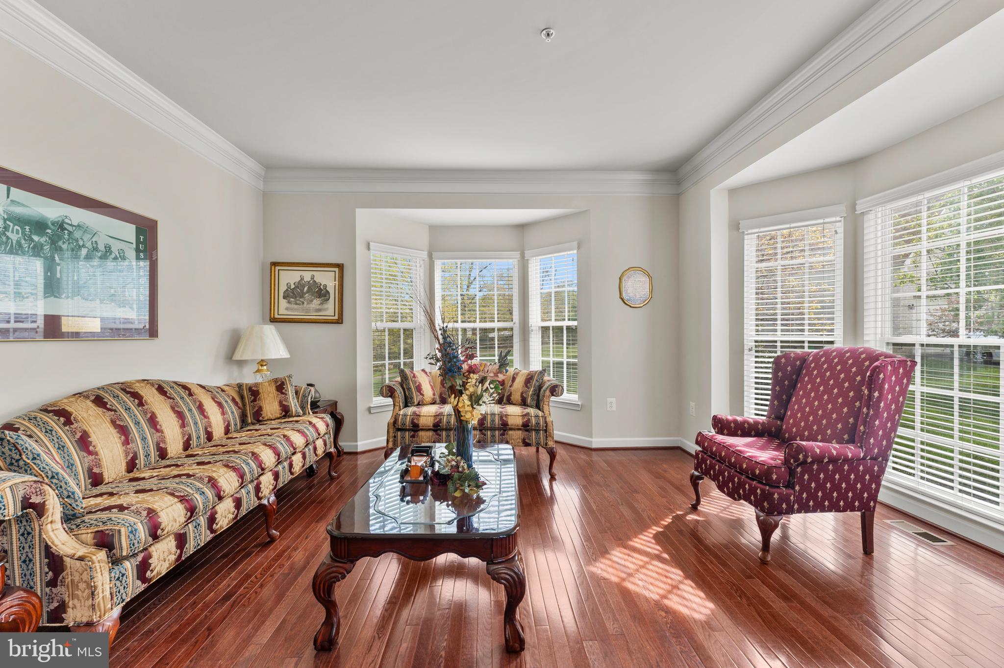 10916 Sir Paul Place Clinton, MD 20735 - Photo 13 of 66 a living room with furniture wooden floor and a window
