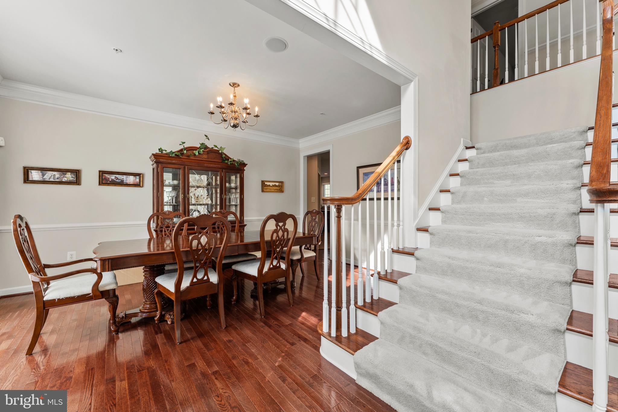 10916 Sir Paul Place Clinton, MD 20735 - Photo 15 of 66 a view of a dining room with furniture and wooden floor
