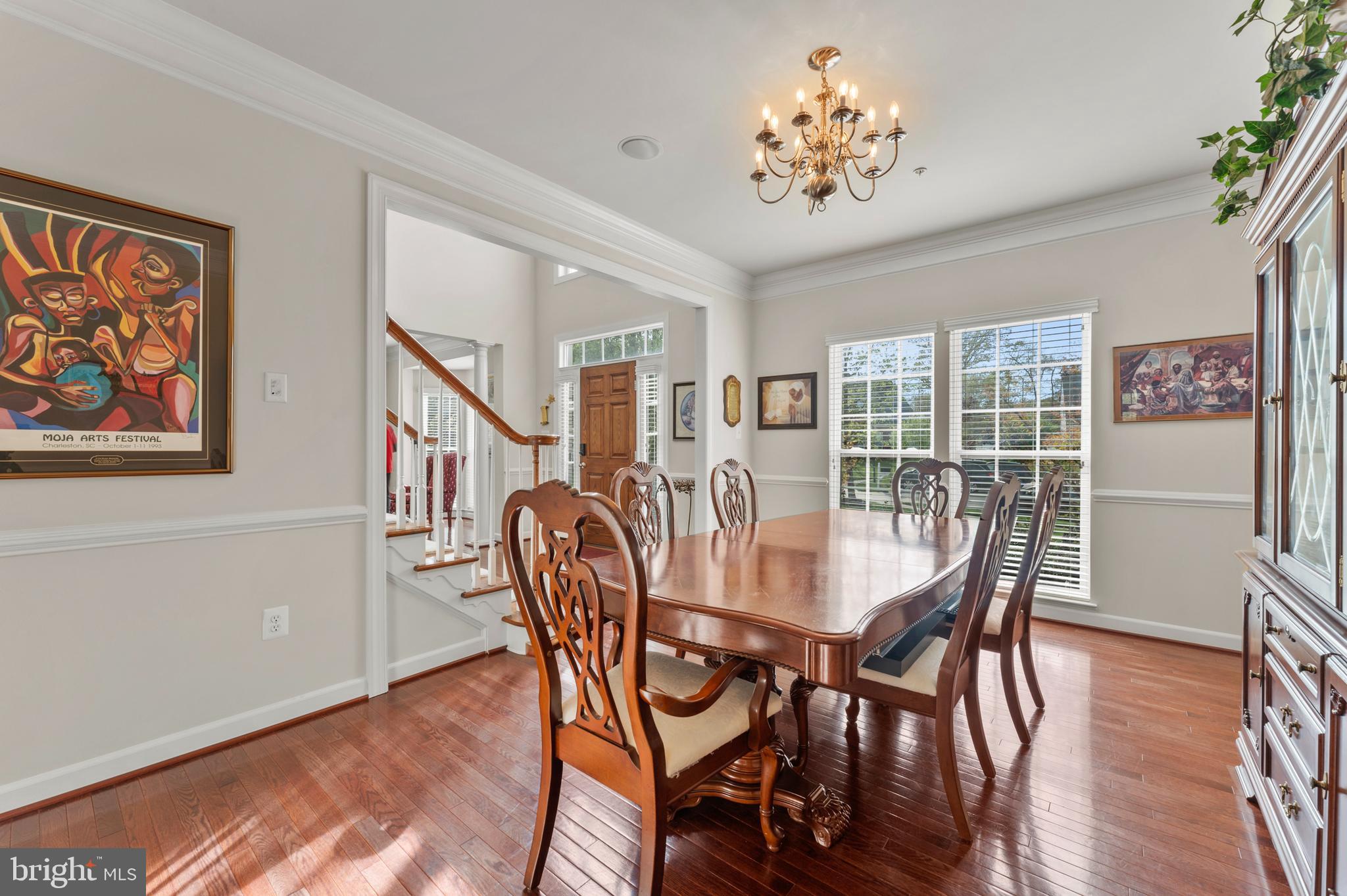 10916 Sir Paul Place Clinton, MD 20735 - Photo 16 of 66 a view of a dining room with furniture window and wooden floor