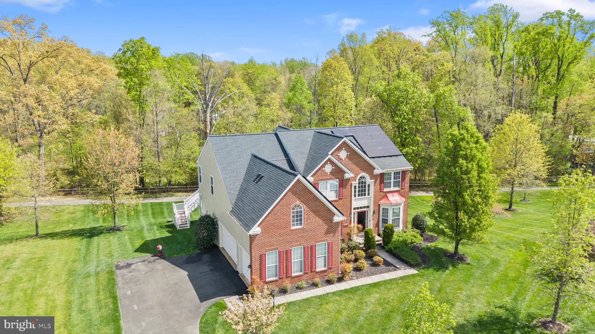 10916 Sir Paul Place Clinton, MD 20735 - Photo 2 of 66 a aerial view of a house with a yard