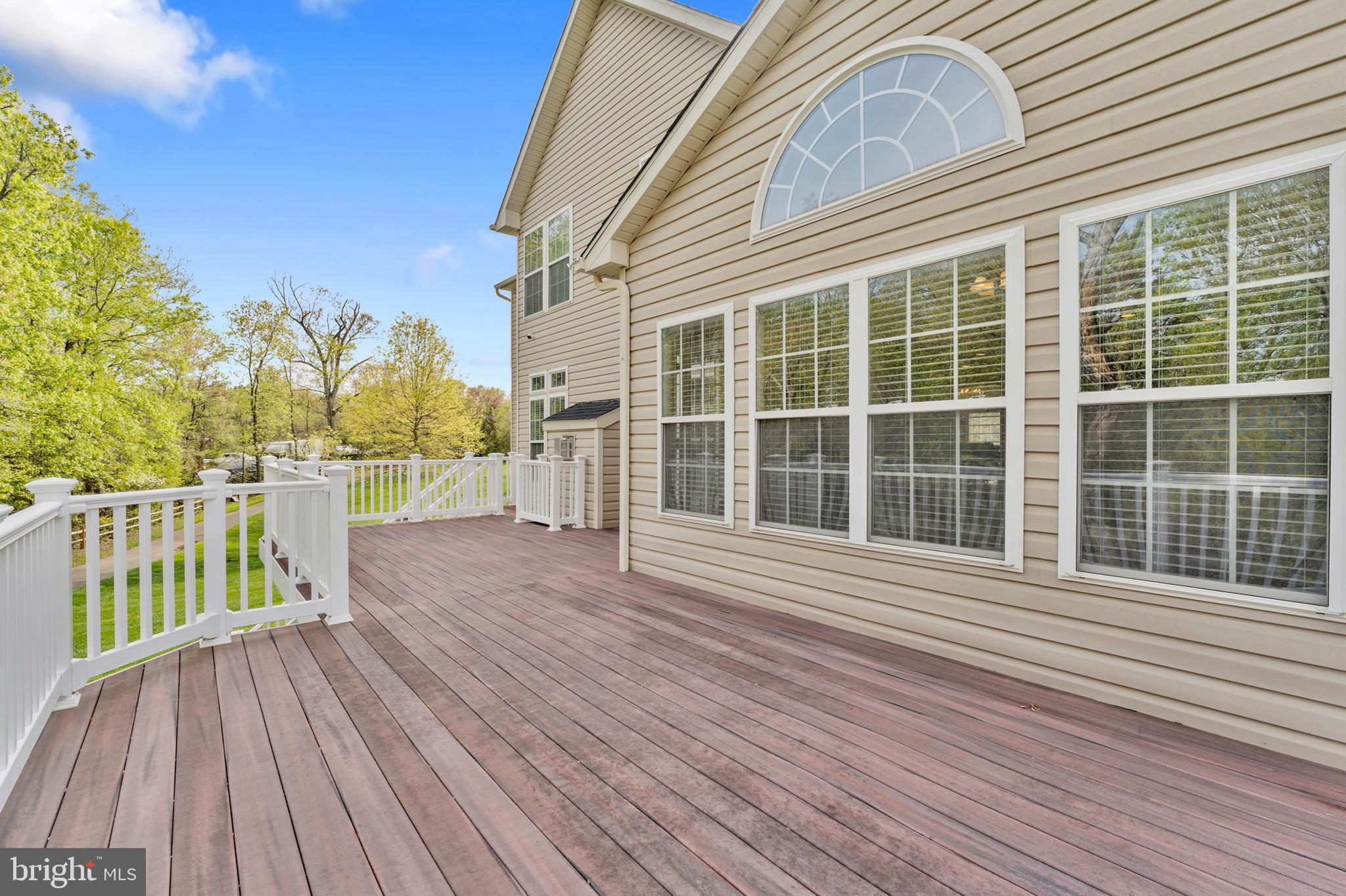 10916 Sir Paul Place Clinton, MD 20735 - Photo 35 of 66 a view of a balcony with wooden floor and fence