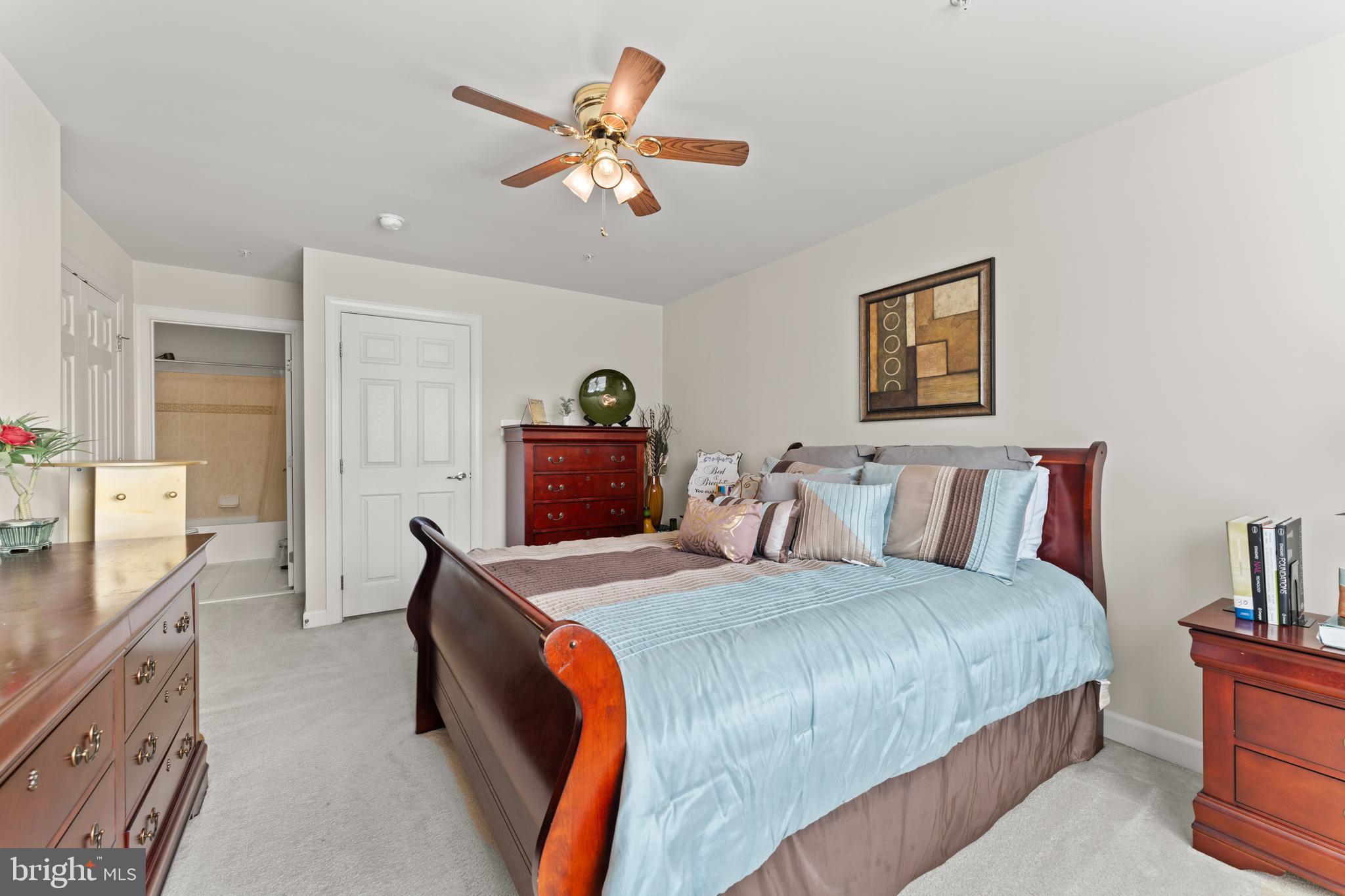 10916 Sir Paul Place Clinton, MD 20735 - Photo 44 of 66 a bedroom with a bed and a chandelier