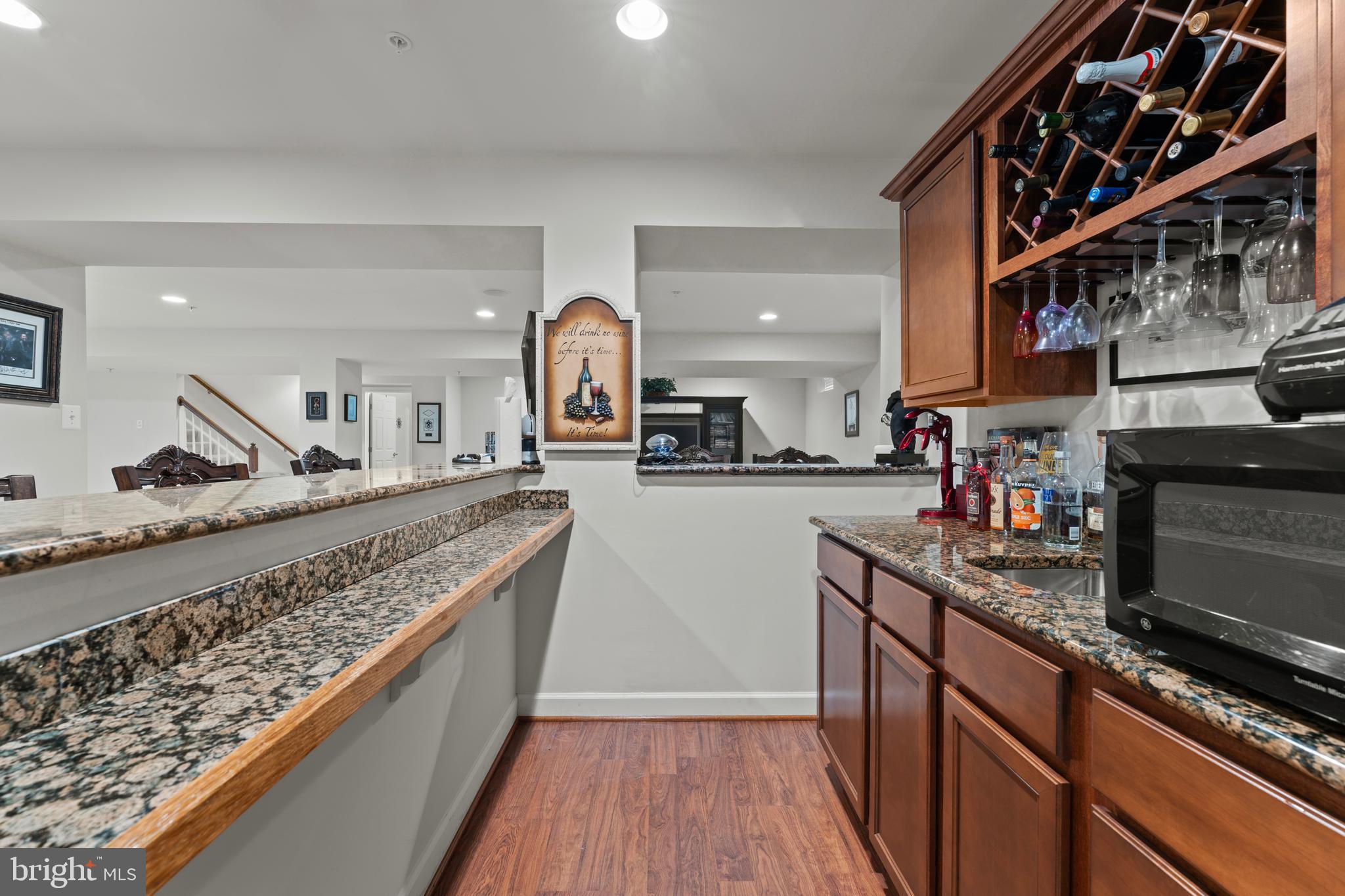 10916 Sir Paul Place Clinton, MD 20735 - Photo 57 of 66 a kitchen with stainless steel appliances granite countertop a stove and a sink