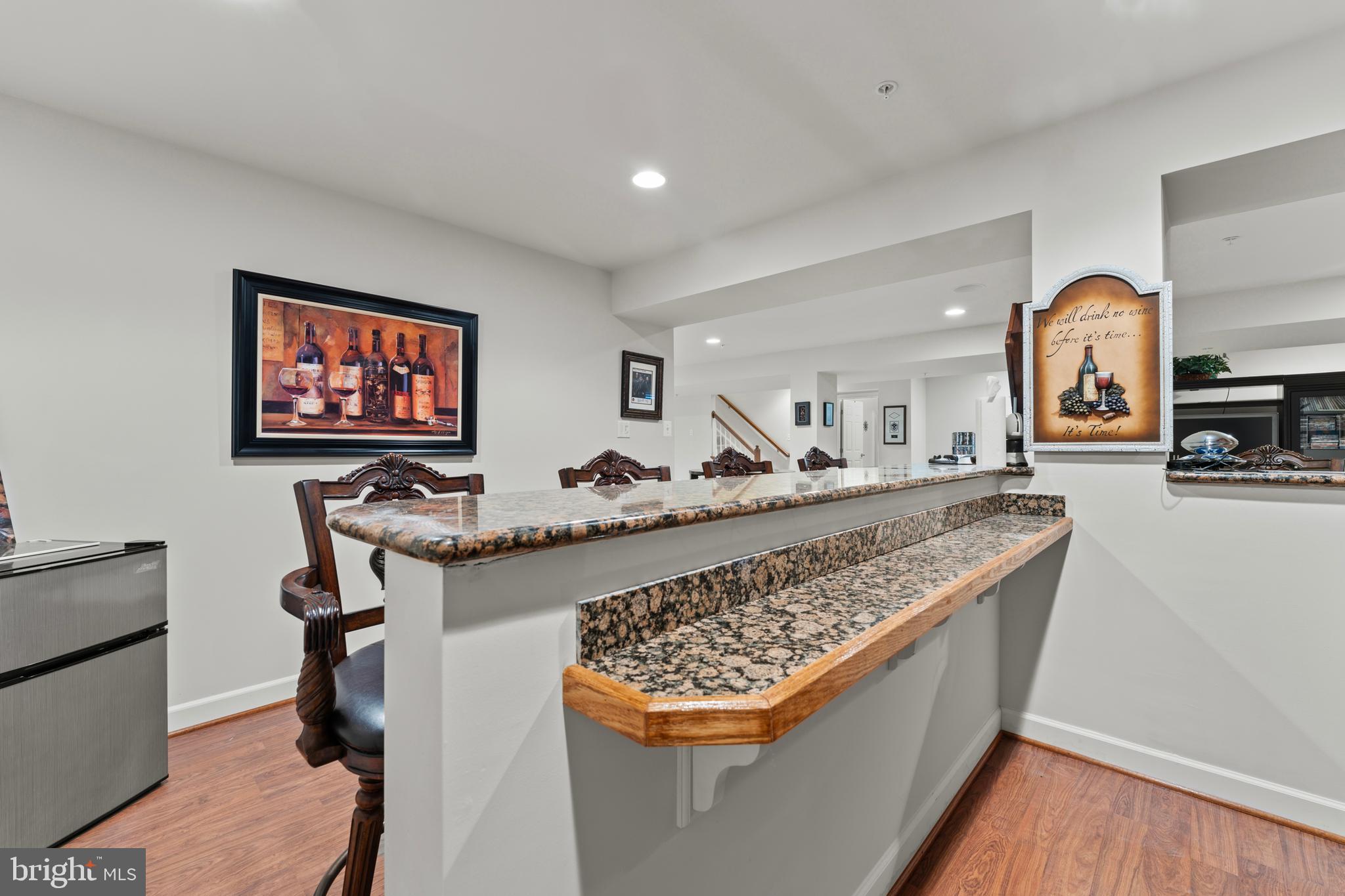 10916 Sir Paul Place Clinton, MD 20735 - Photo 58 of 66 a living room with stainless steel appliances granite countertop furniture and a kitchen view