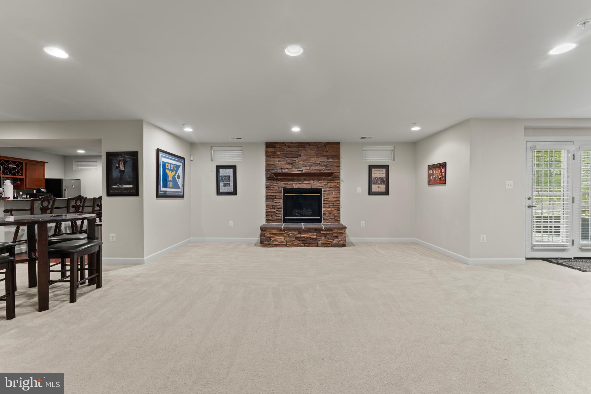 10916 Sir Paul Place Clinton, MD 20735 - Photo 60 of 66 an empty room with furniture and fireplace