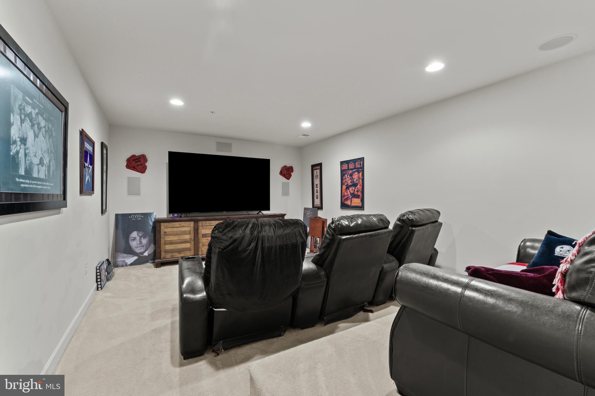 10916 Sir Paul Place Clinton, MD 20735 - Photo 62 of 66 a living room with furniture and a flat screen tv
