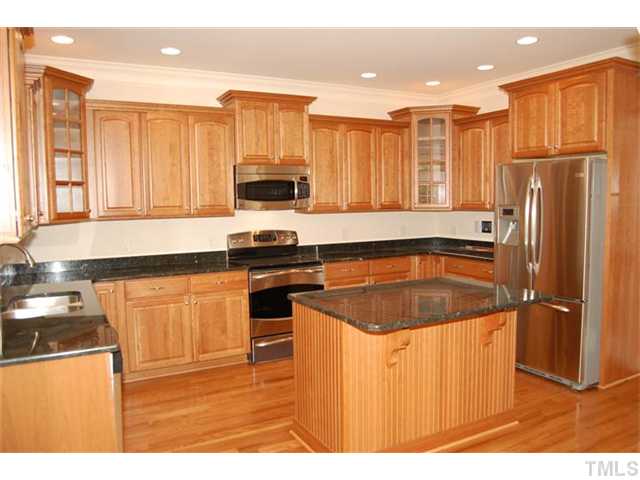 294 High Ridge Lane Pittsboro, NC 27312 - Photo 2 of 11 a kitchen with stainless steel appliances granite countertop a refrigerator a stove and a sink