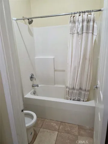 a bathroom with a sink a toilet and a bathtub