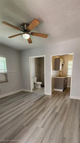 a view of a livingroom with a furniture wooden floor and window